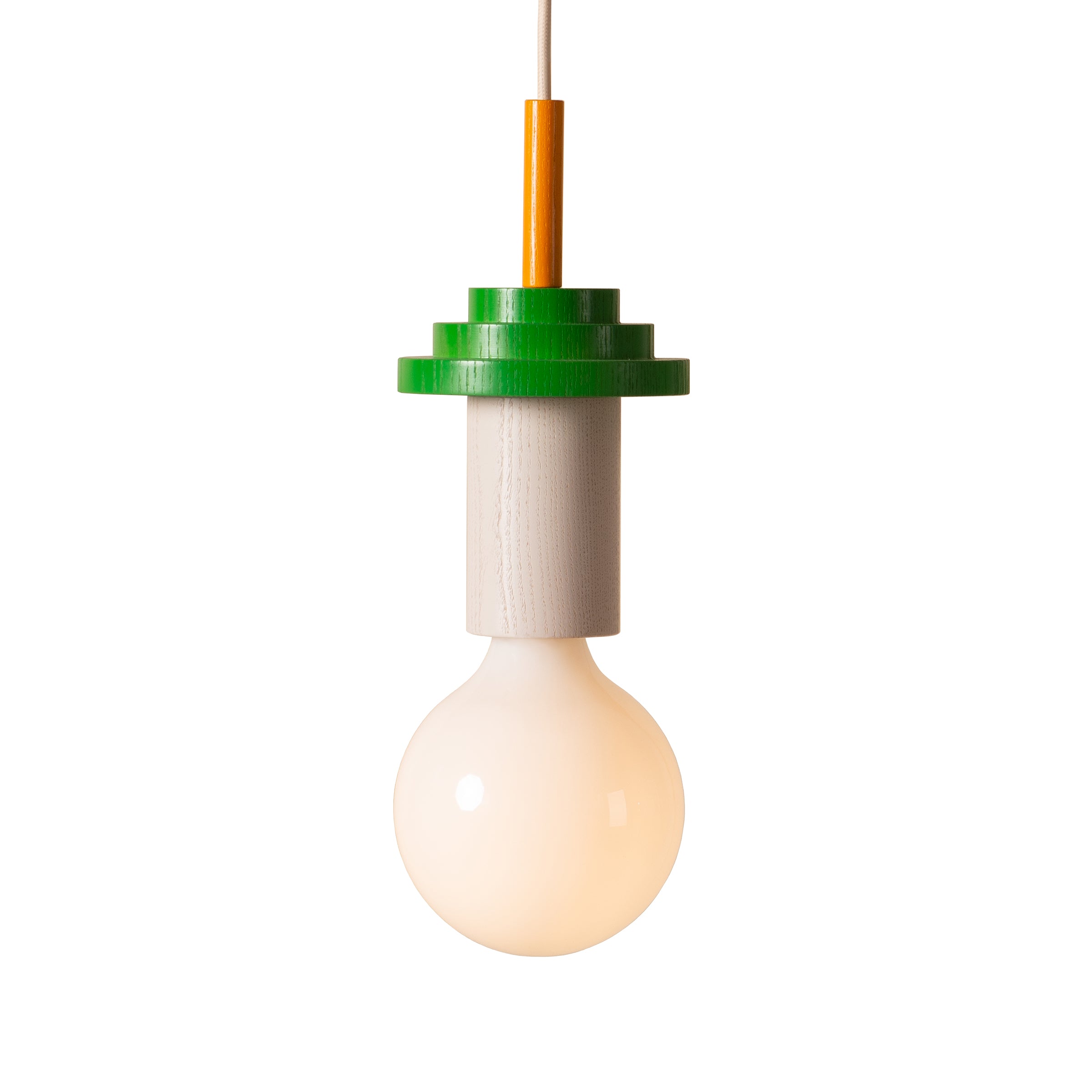 The Junit Torta by Schneid is a modern pendant light with a spherical bulb providing ambient light. It hangs from a thin cable and features a green, tiered cylindrical fixture at the top, reminiscent of Bauhaus design, casting a soft glow against a white background.