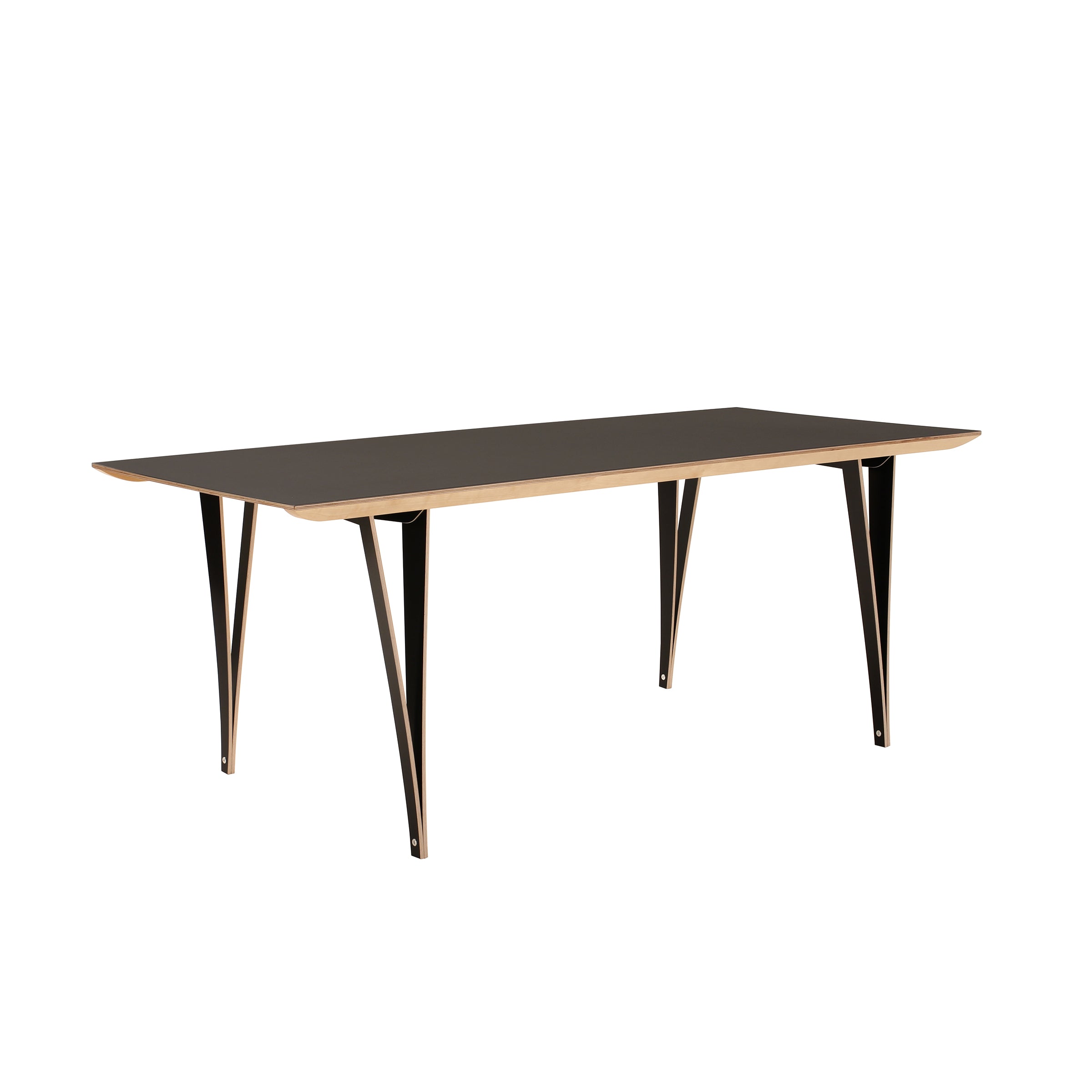 The Spanoto by Moormann is a birch plywood dining table with a sleek black surface and light wood edges. It features four angled black metal legs for a modern look and includes an assembly tool for effortless setup.