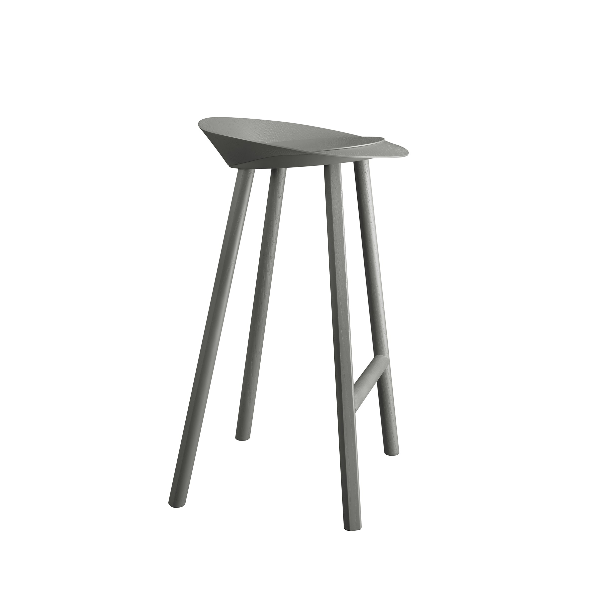 The ST10 JEAN bar stool by E15 showcases a minimalist design with a sleek, curved seat made from oak-veneered plywood. It features four slender legs, a muted gray finish, and includes a footrest for enhanced comfort and functionality.