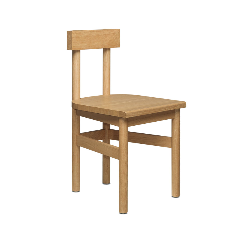The SX01 GAMAR Chair by E15 is a minimalist rustic wooden chair featuring a simple design with a flat seat, straight backrest, four cylindrical legs, and a natural European oak finish for a functional and understated appearance.