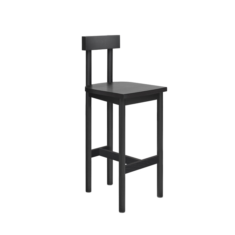 The SX02 GAMAR BARSTOOL by E15 is a simple black wooden chair crafted from European oak, featuring a flat seat, minimal backrest, and four straight legs. Part of the GAMAR collection, it offers straightforward functionality suitable for various settings.