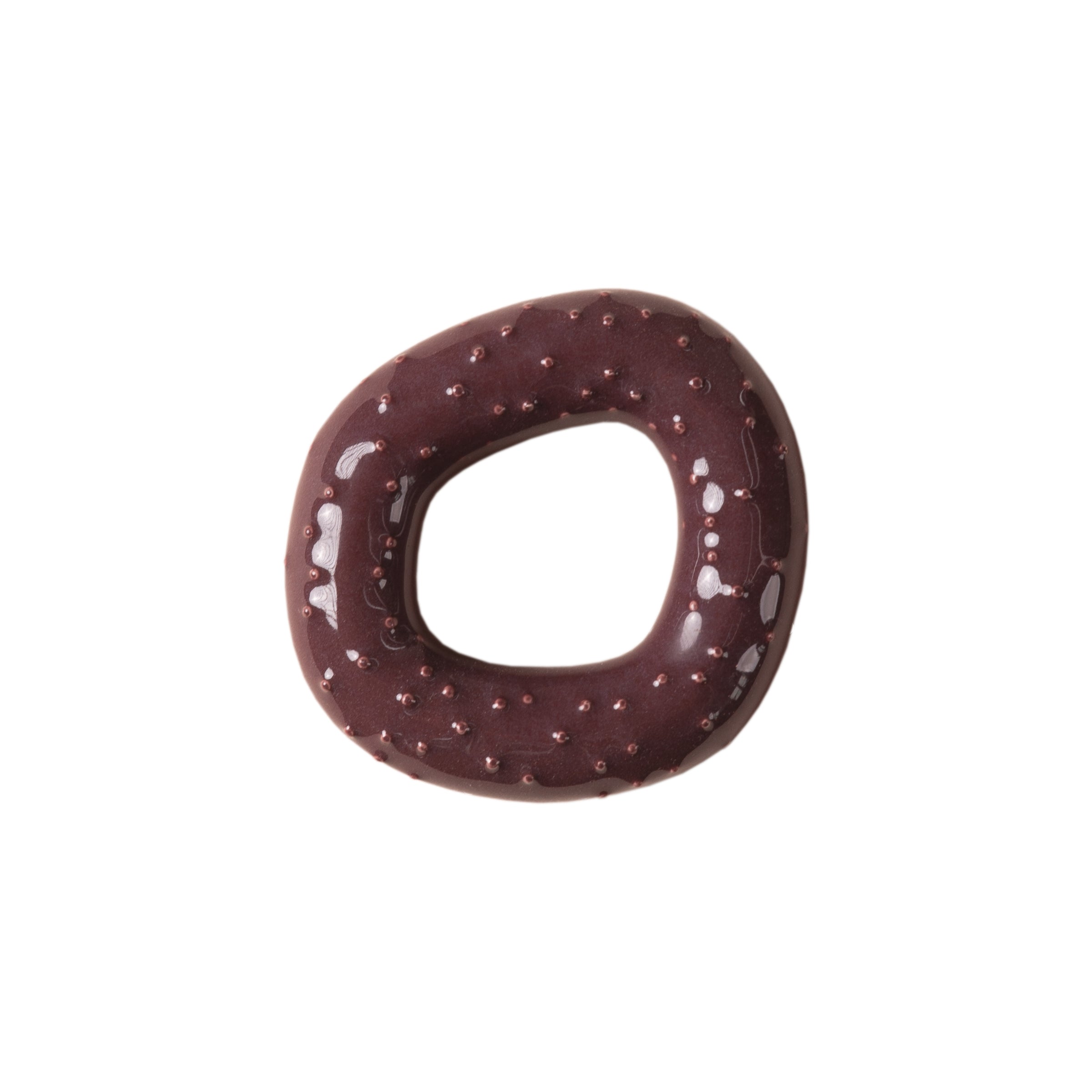 A Fossil Hooks donut by Schneid, featuring a glossy dark chocolate icing and an organic shape, viewed from above on a plain white background.