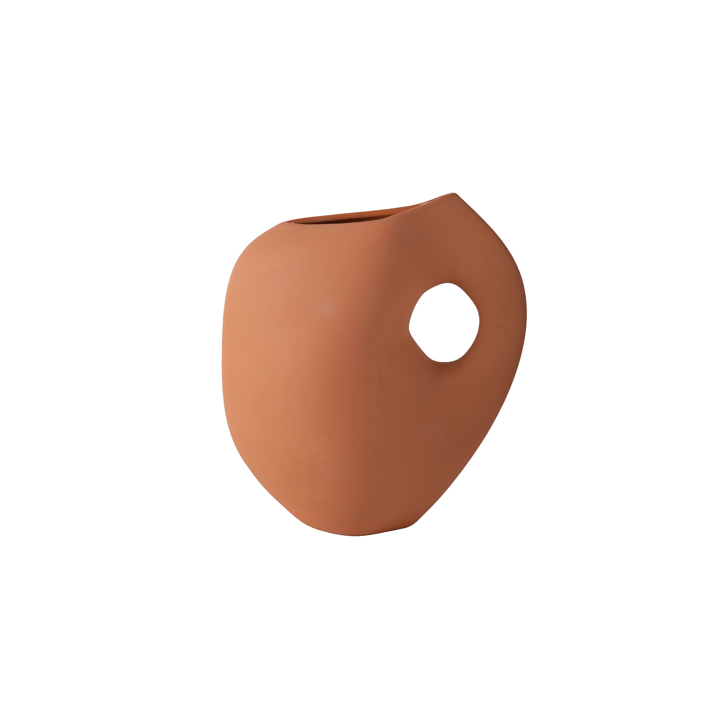 Terracotta-colored Aura I vase by Schneid with a smooth surface and asymmetric, organic design features a large round hole near the top, resembling modern artistic pottery. The stoneware object is set against a plain white background.