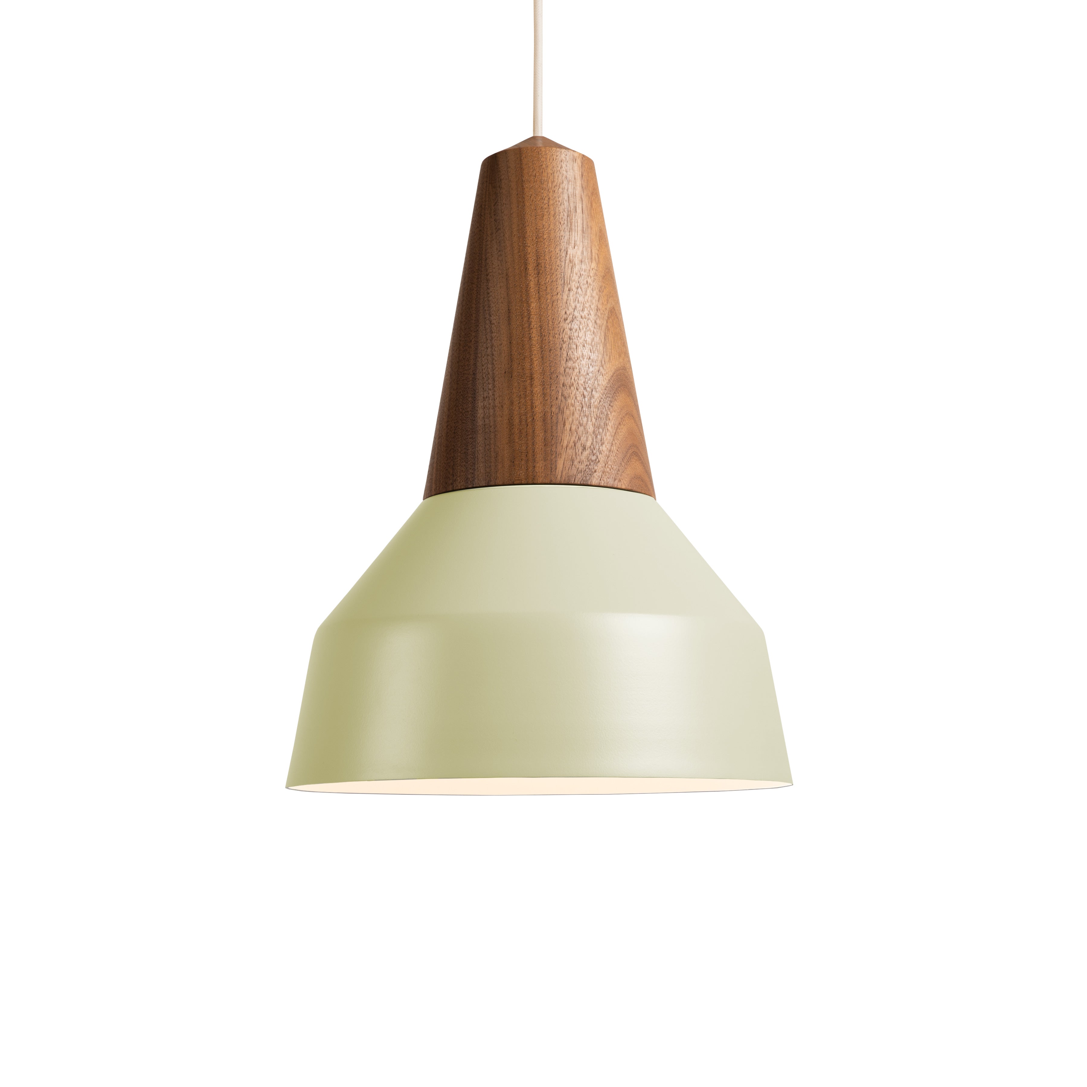 The Eikon Basic Pistache by Schneid is a pendant lamp with a certified wood top and a matte sage green conical shade. It features an innovative magnetic system for easy assembly, style versatility, and is suspended by a white cord against a plain backdrop.