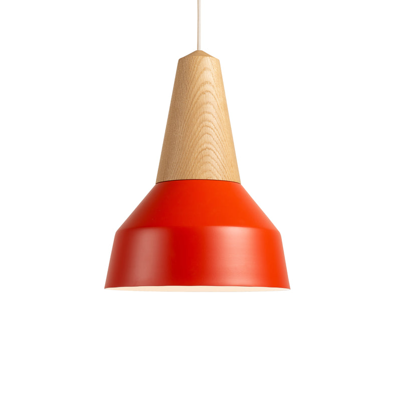 The Eikon Basic Poppy Red by Schneid showcases a modern design with a certified wooden conical top and vibrant red metal shade. It features an elegant light with a magnetic connecting system, hanging gracefully from a cord against a pristine white backdrop.
