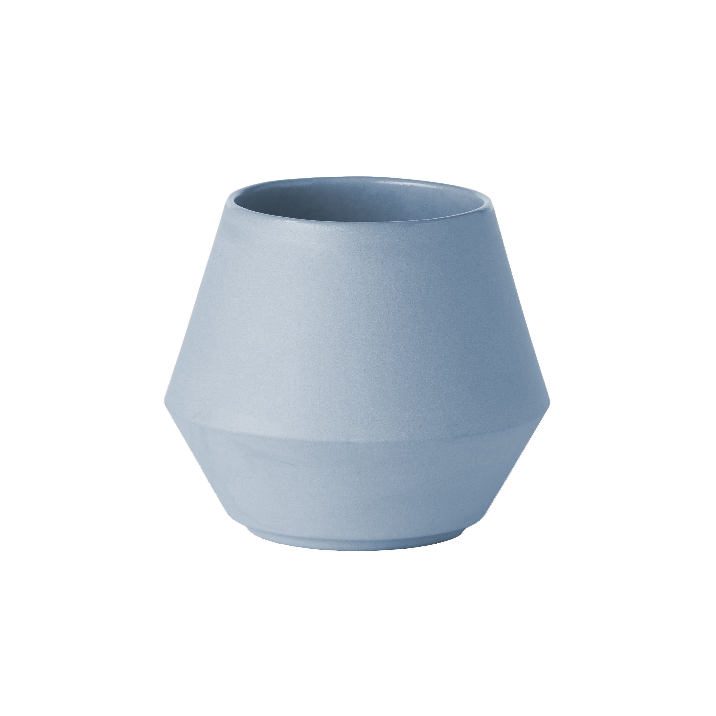The Unison Sugar Bowl by Schneid is a minimalist, matte light blue ceramic piece with a geometric design. Handmade in Germany, it has a wide base tapering slightly toward the mouth and sits elegantly on a white background as part of their unique tableware collection.