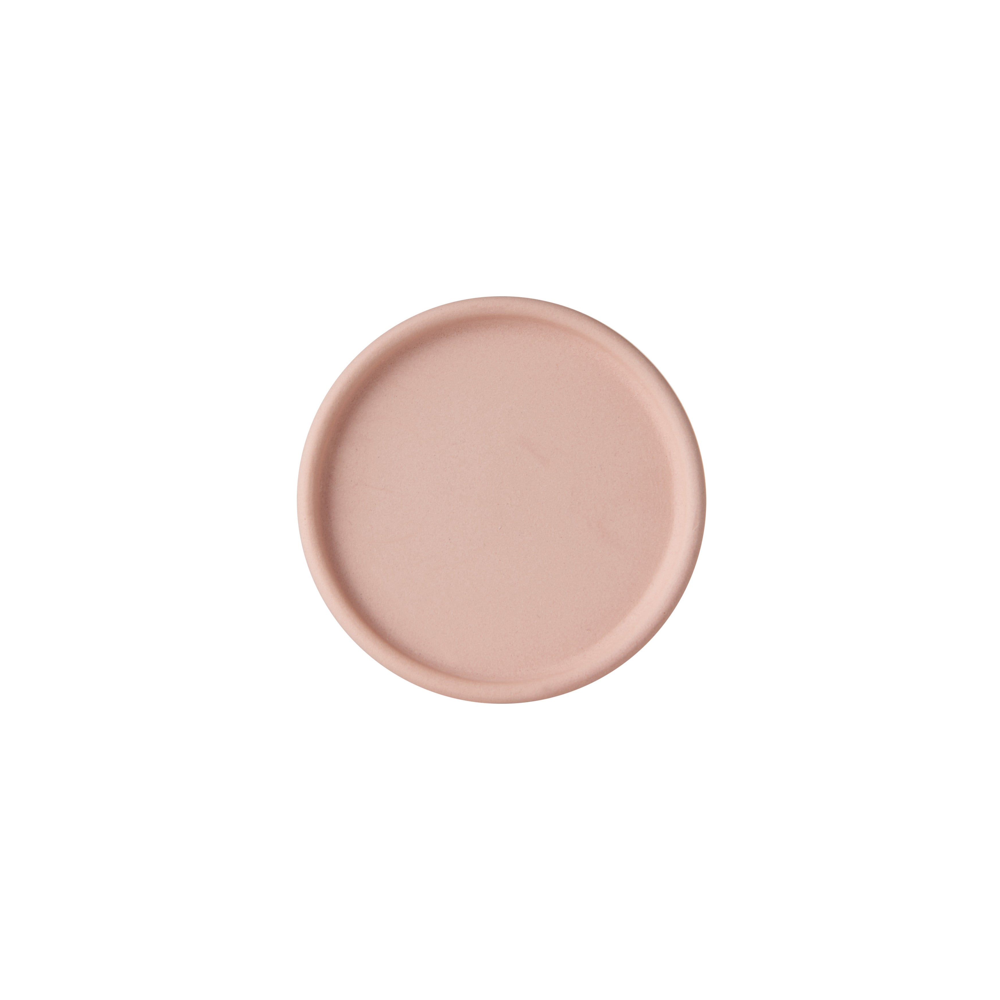 The Unison Carafe by Schneid is a handcrafted, plain, round, light pink coaster with a slightly raised edge, designed in Germany for easy stacking and displayed on a white background.