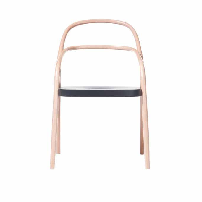 The TON Chair 002 features a minimalist design with a light brown frame and sleek black seat, viewed frontally. Its curved backrest offers a modern twist on a classic model.