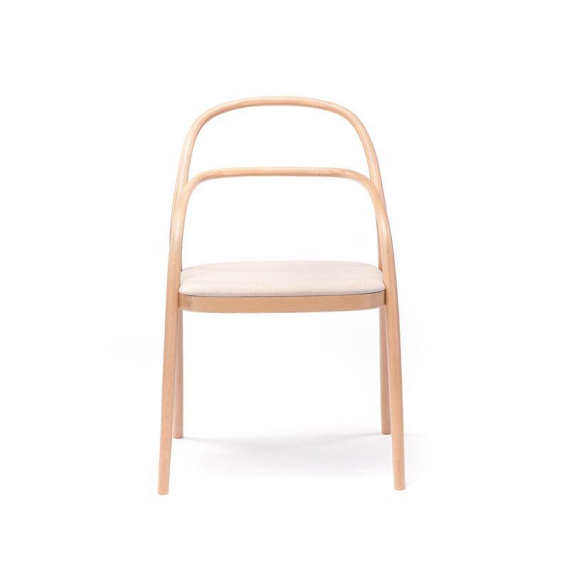 Chair 002 - Upholstered by TON features a wooden frame with a curved backrest, light beige cushioned seat, and slender straight legs that recall the iconic No. 14 redesign. This minimalist design stands elegantly against a crisp white background, embodying the TONDesigner aesthetic.