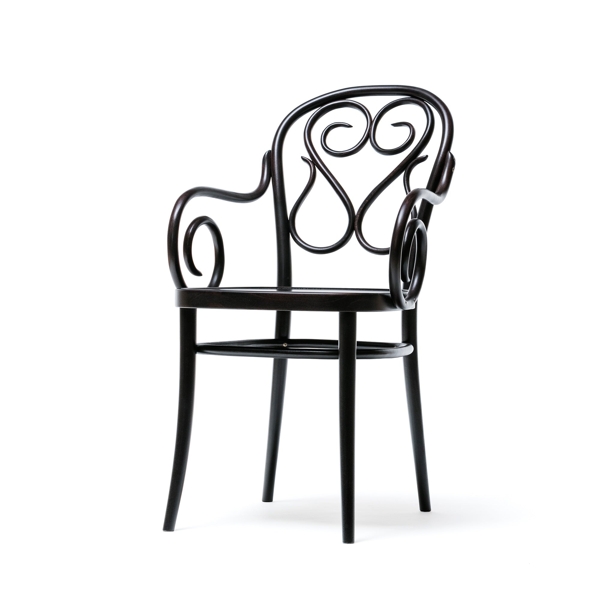 The Armchair 04 by TON is a black wooden chair with a decorative curvy backrest, rounded armrests, and slender legs, showcasing an elegant and artistic style.