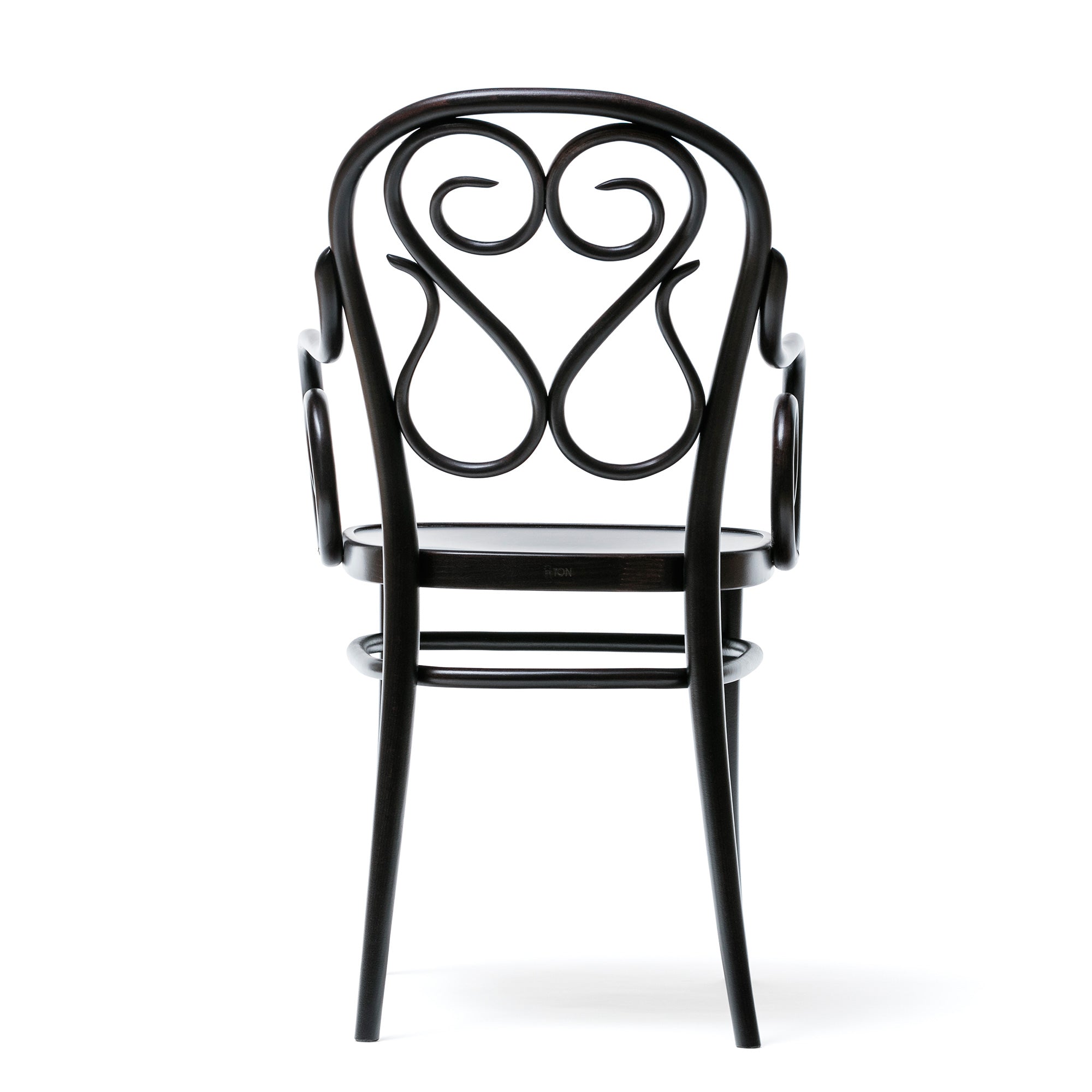 The Armchair 04 by TON is a classic Bentwood chair with a dark wooden frame, featuring an intricate scroll design on the backrest, a rounded seat, and elegant curves that blend tradition with sophistication.