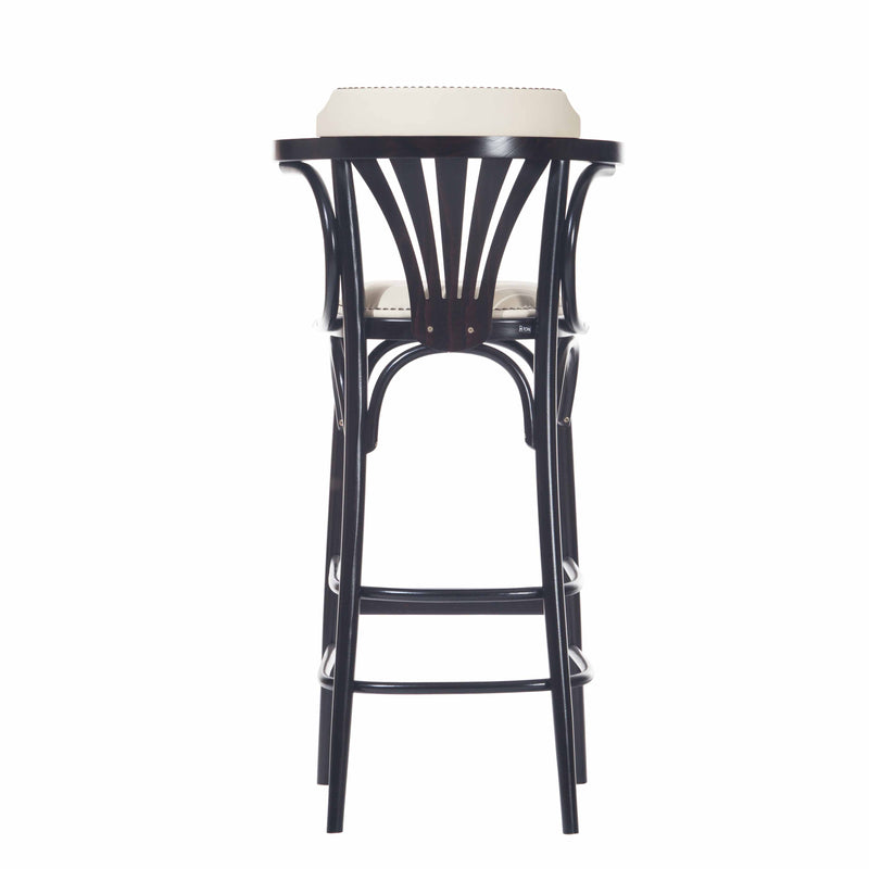 The TON Barstool 135 is a black wooden barstool with a curved backrest, cushioned seat, and sleek armrests. It features an elegant arch beneath the seat for a sophisticated appearance.