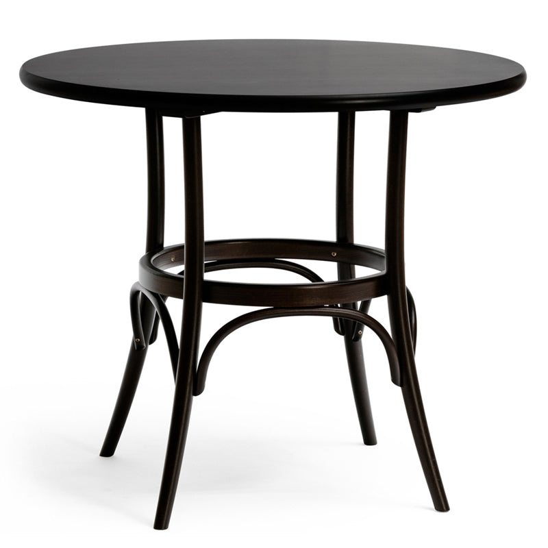 The Table 152/252 by TON features a sleek round design in dark brown bentwood, with a wide top and elegantly curved legs linked by a circular support. Its solid construction ensures modern elegance, strength, and stability.