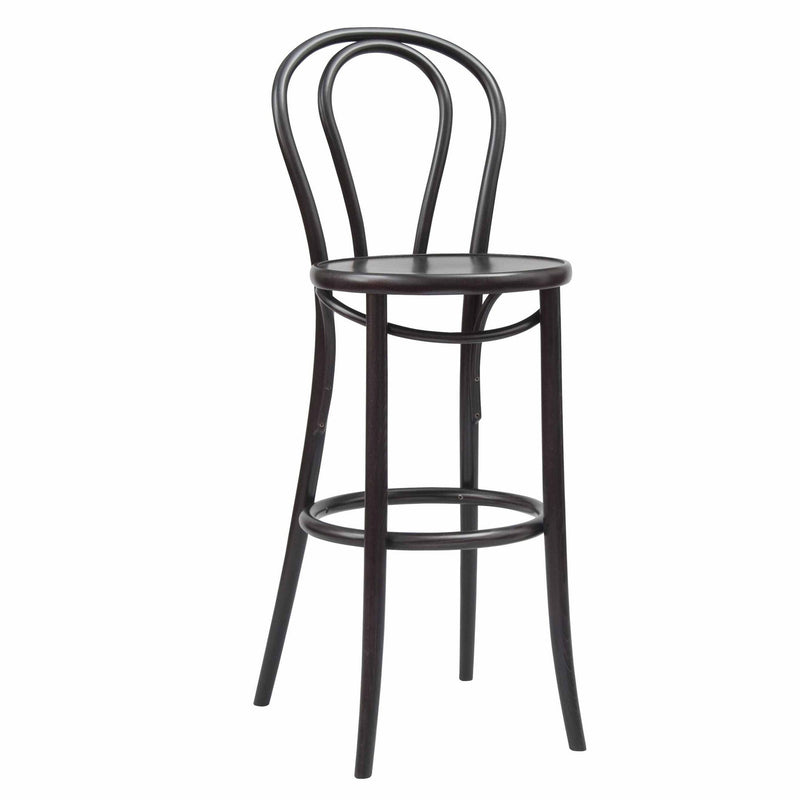 The TON Barstool 18 is a tall, elegant piece with a curved backrest and circular seat made of smooth plywood. It features four slender legs and a round footrest, blending classic design with refined upholstery accents.