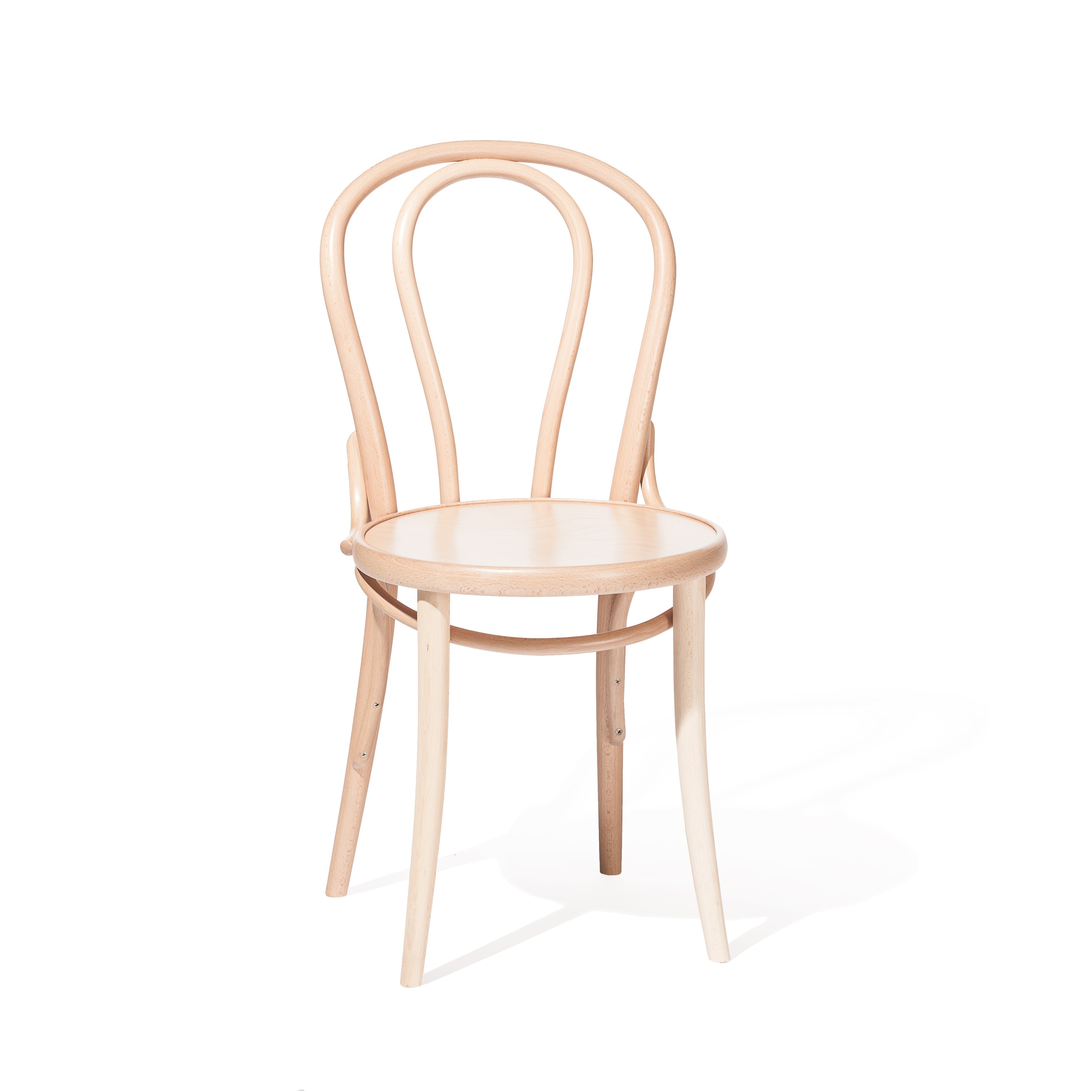 The Chair 18 - Cane by TON is a beech wood dining chair boasting a light, natural finish and classic bentwood design, featuring an open rounded backrest with curved lines and four slender legs.