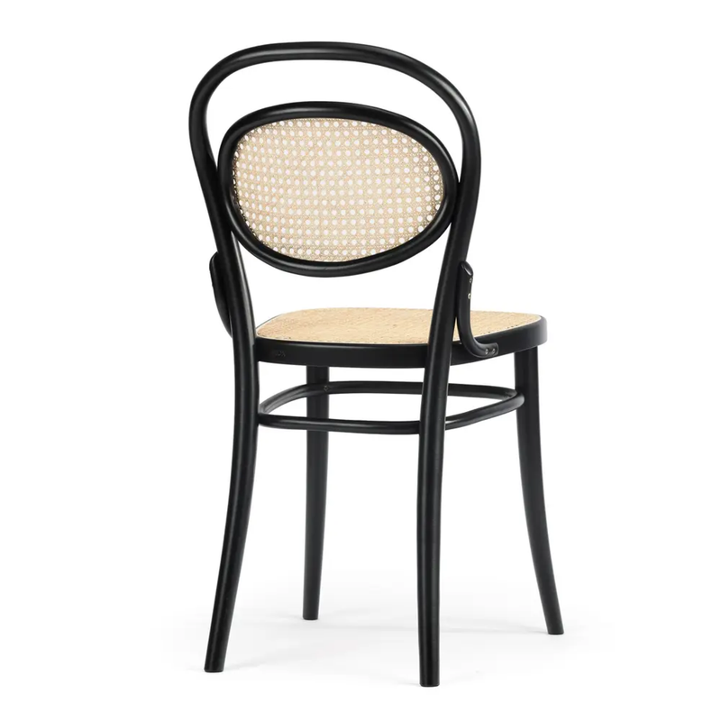The Chair 20 Cane by TON is a black wooden dining chair with a curved backrest and elegant woven cane seating, featuring both the seat and backrest in cane. It highlights a classic, simple design with clean lines and smooth finishes against a white background.
