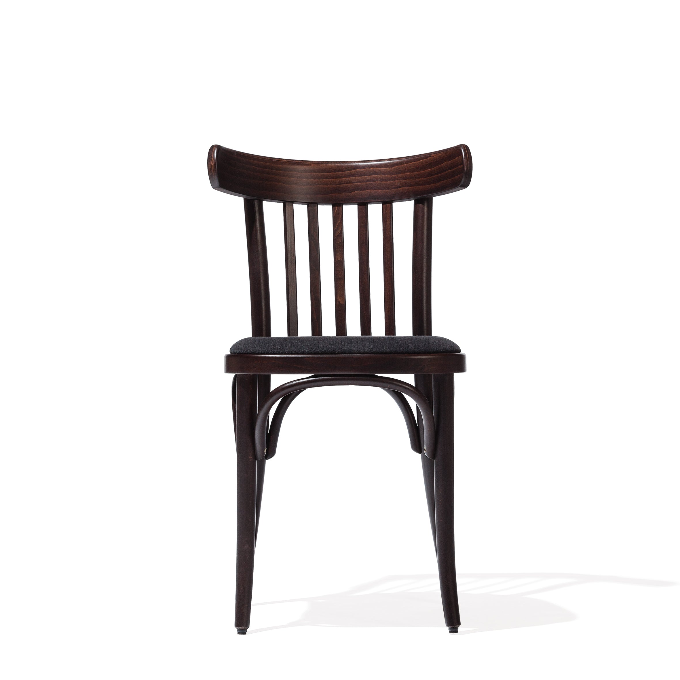 The TON Chair 763 - Upholstered features a dark beech frame with a curved backrest and vertical slats. With its cushioned seat and elegantly curved legs, it enhances modern interiors beautifully against a plain white backdrop.