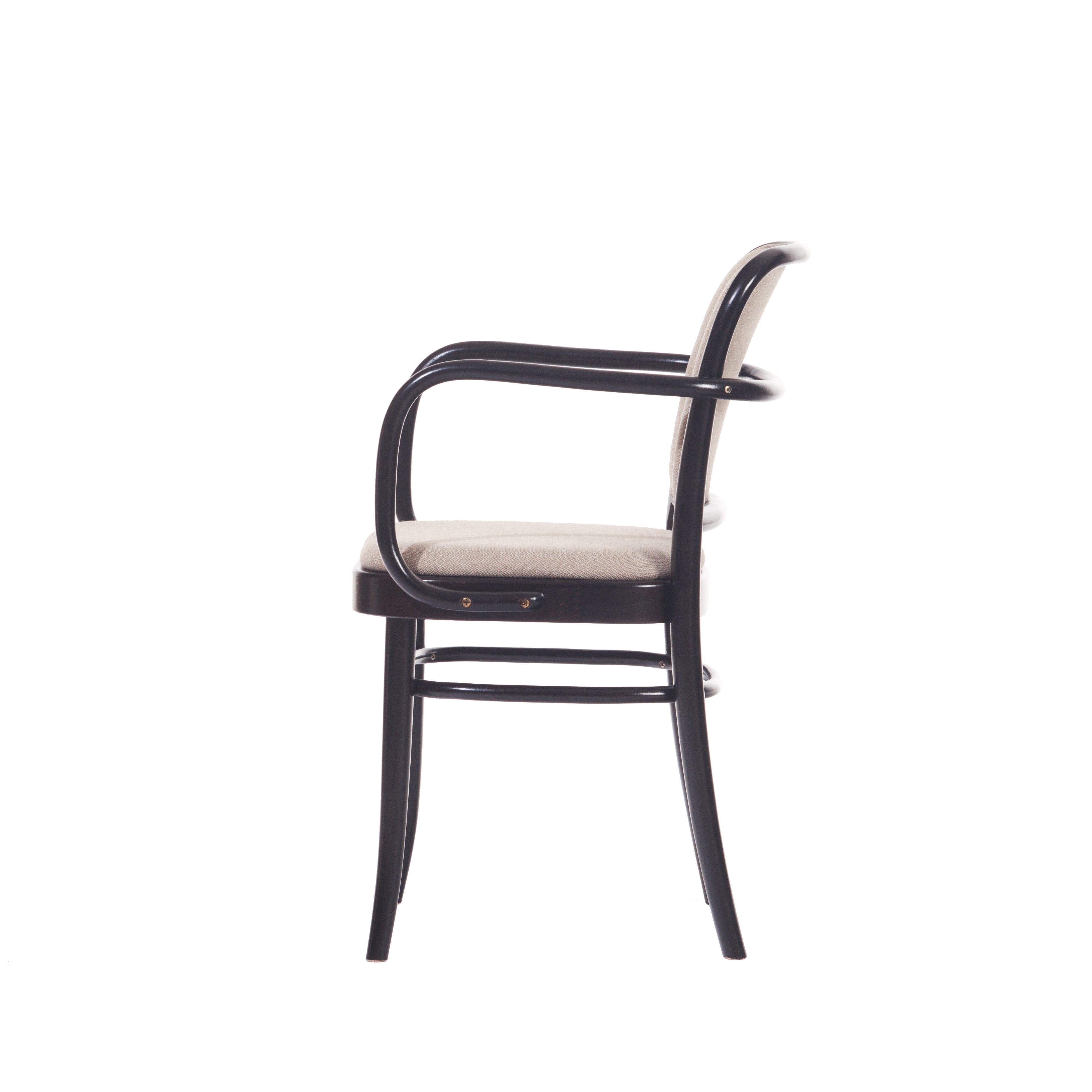 Side view of the Armchair 811 by TON, a black wooden piece with a curved backrest and armrests reminiscent of Josef Hoffmann design. It features a light fabric cushion and stands on slender legs, embodying minimalistic elegance akin to Art Nouveau aesthetics.