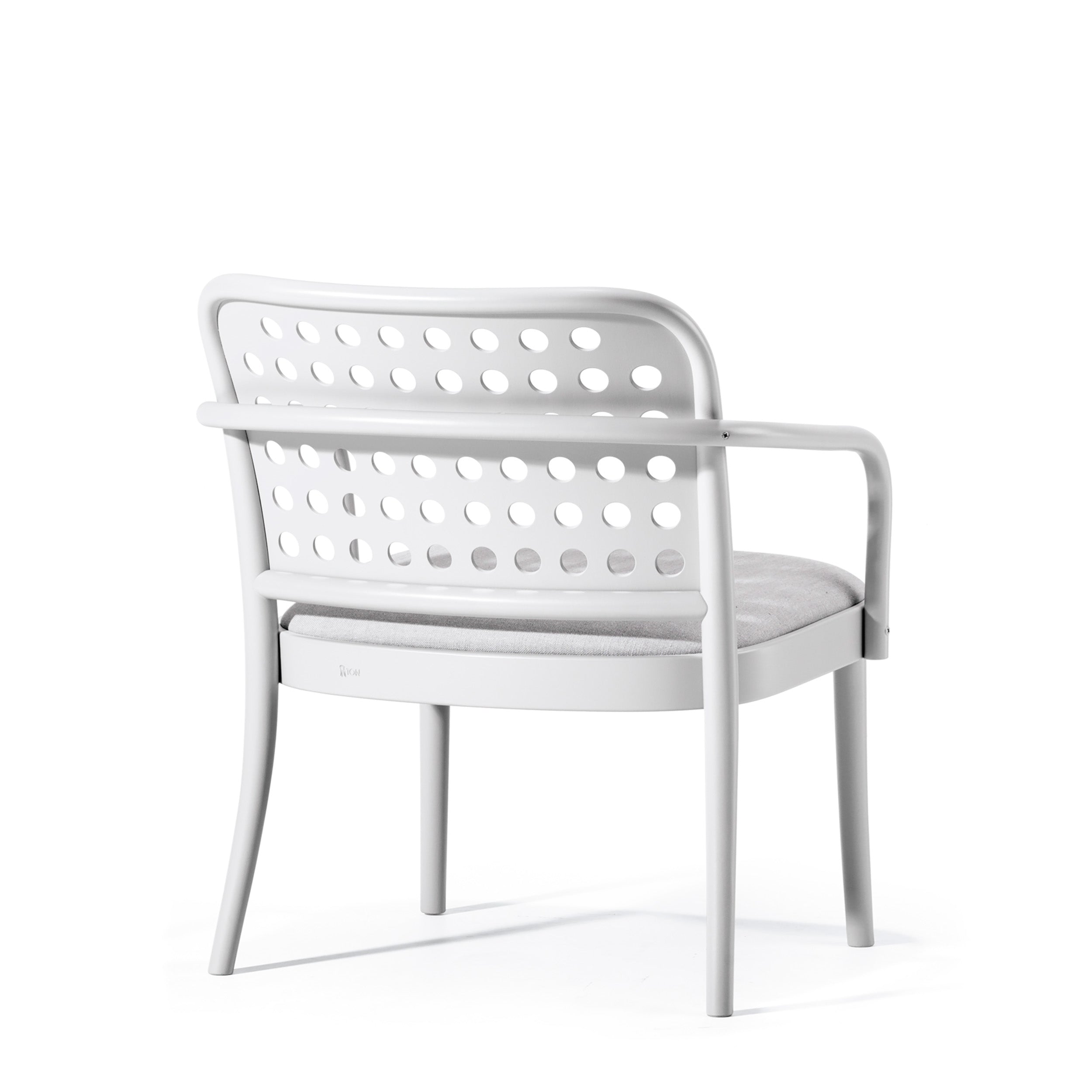 The Lounge Armchair 822 by TON, designed by Claesson Koivisto Rune, embodies Scandinavian minimalism with a white frame, perforated backrest, and four-leg design. Its cushioned light-grey seat offers comfort while it faces left in a sleek and modern style.