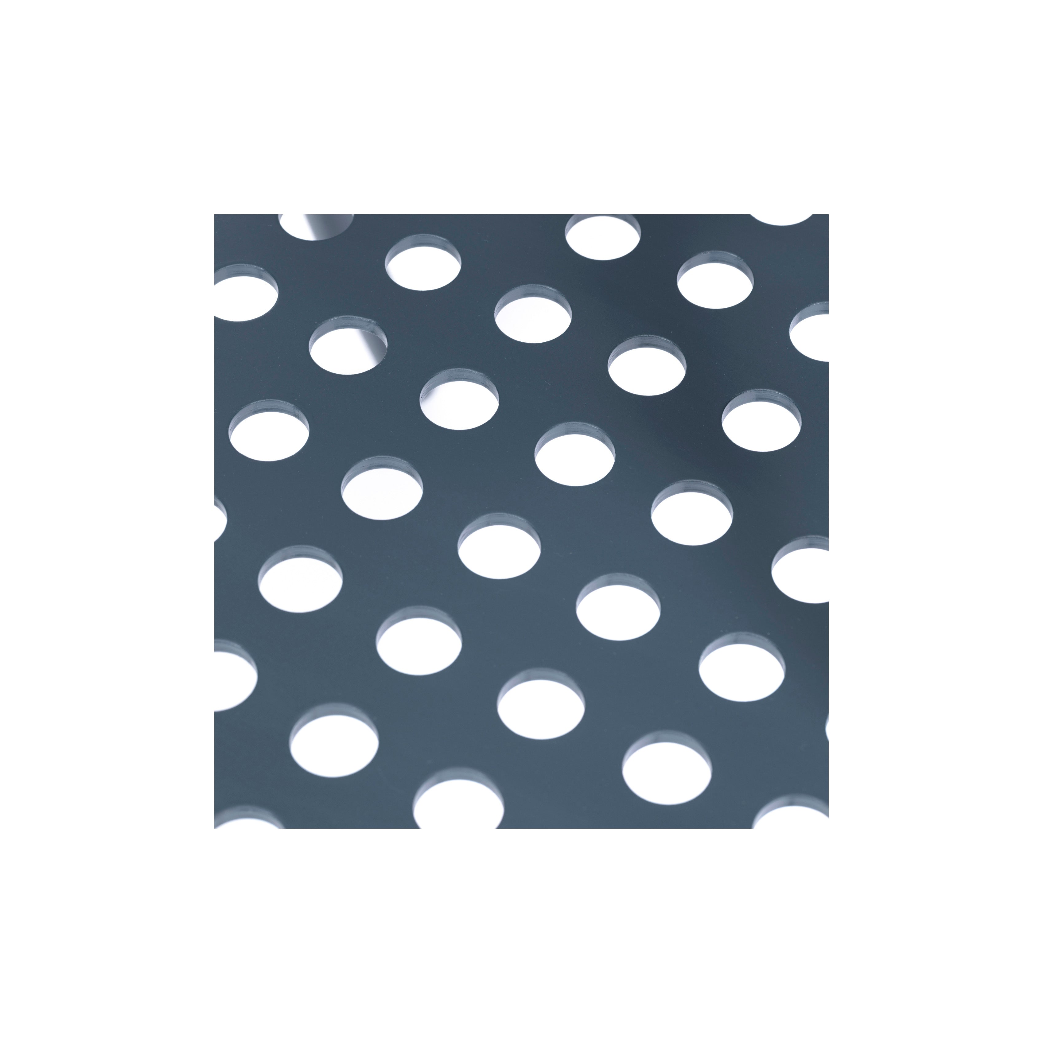 Close-up of the Lounge Armchair 822 by TON, showcasing its perforated metal sheet design with evenly spaced circular holes. Light reflects subtly on the gray surface against a white background, highlighting Scandinavian minimalism through its refined simplicity and texture.