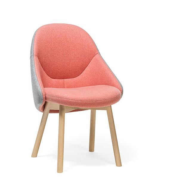 The Chair Albu – Sale by TON, designed by Alex Gufler, features a pink cushioned seat and backrest with precise stitching. It has light beige wooden legs and gray fabric sides, all set against a plain white background.