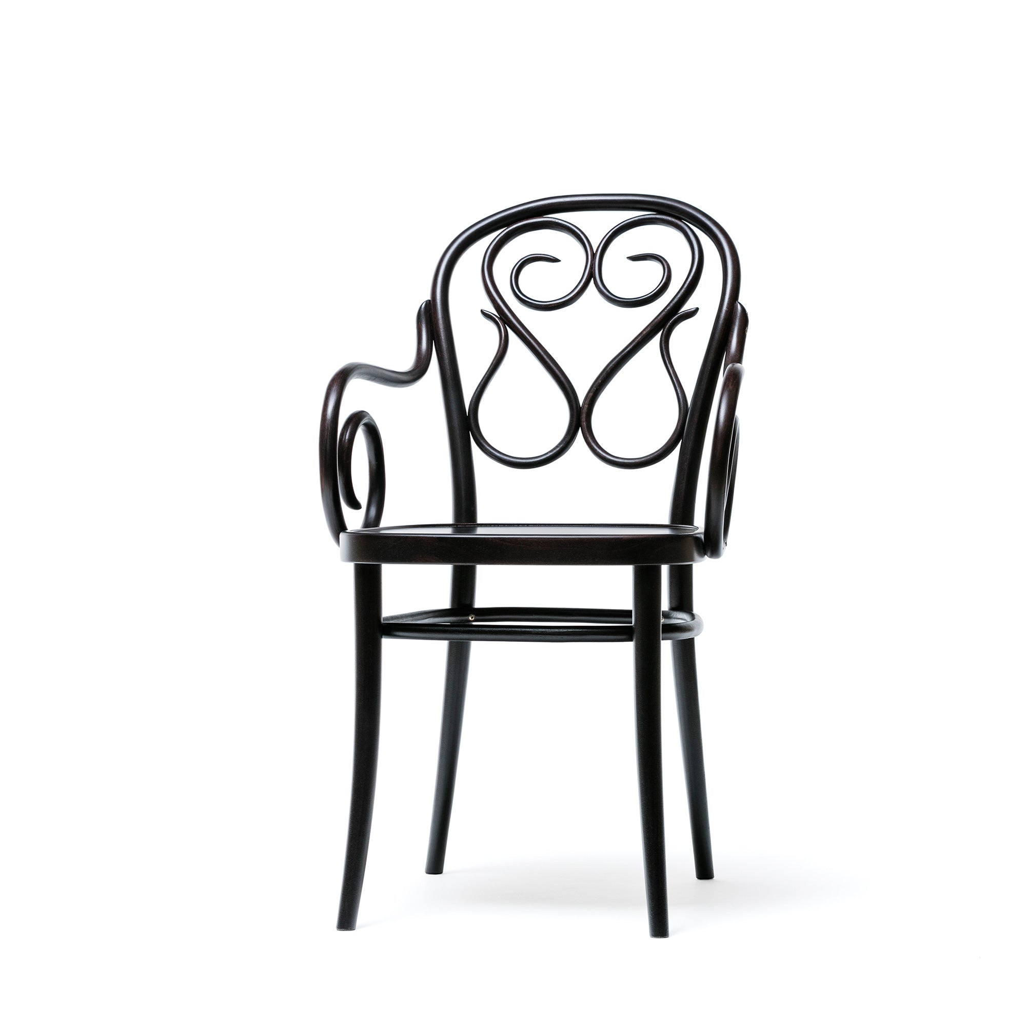 The Armchair 04 by TON is a black wooden chair with curved, decorative backrest and armrests. It features elegant swirls, bent details, a smooth glossy finish, and four legs.