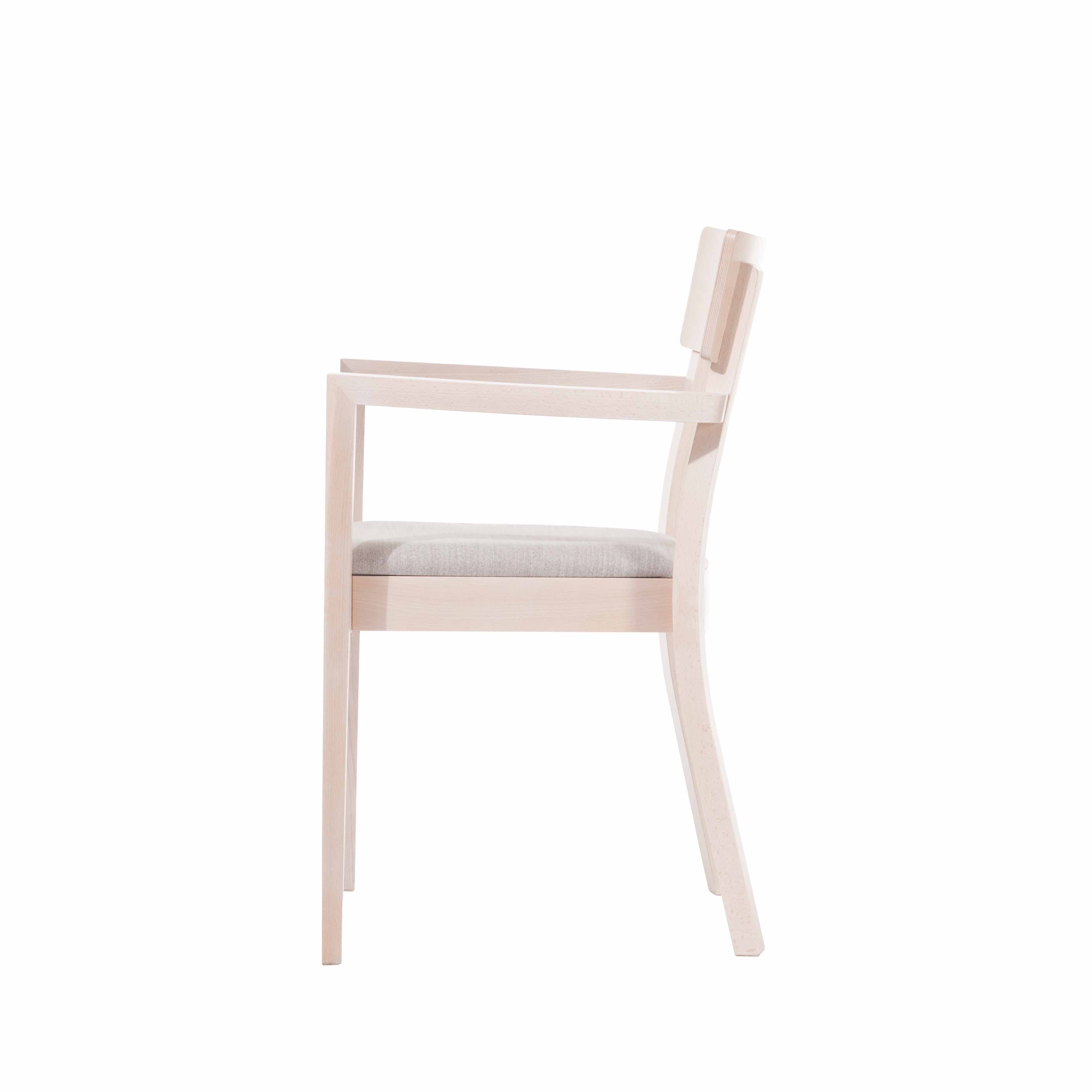 Side view of the Armchair Bergamo by TON, a modern minimalist design in beech with a light beige cushion. Its clean lines and pale wood finish add elegance and versatility to contemporary interiors.