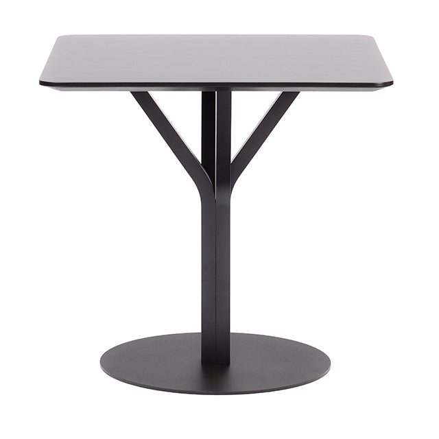The Bloom Bistro Table Square by TON is a minimalist black table with a matte finish, featuring a single Y-shaped pedestal base on a circular metal footing. Its part of the Bloom small tables collection, ideal as a multipurpose table for any modern space.