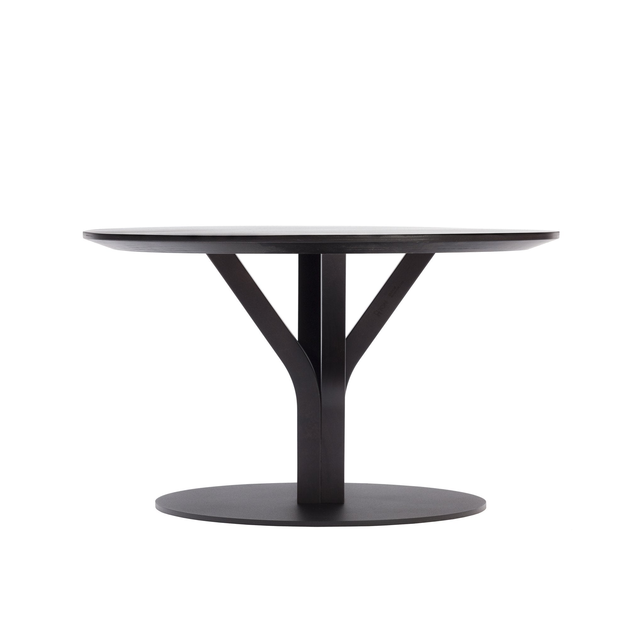 The Bloom Coffee Table by TON is a modern round piece crafted from solid wood, featuring a flat tabletop with a sleek Y-shaped central support connecting to its circular base. Its minimalist design emphasizes clean lines and symmetry.