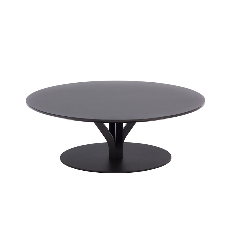 The Bloom Coffee Table by TON features a sleek, black, round design with a smooth solid wood surface. It includes a thick central support on a circular base, embodying modern and minimalist aesthetics.