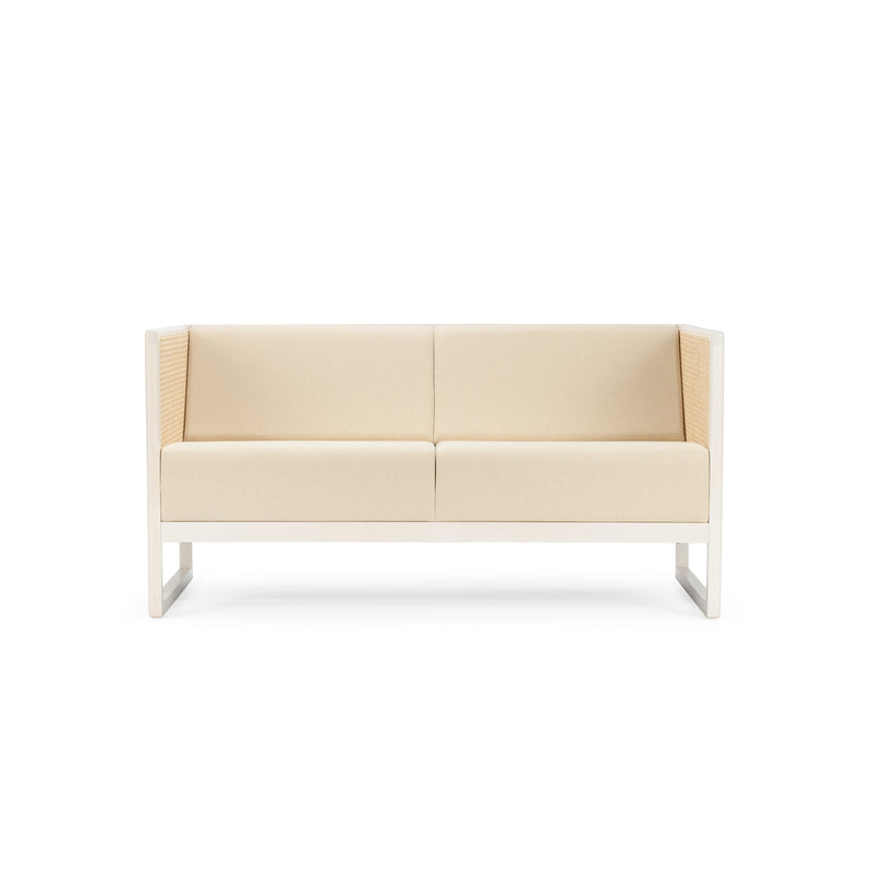 The TON Casablanca Sofa, with its minimalist design, features a beige finish, cane weave armrests, and a wooden frame. It includes two seat cushions and clean lines that echo the elegance of the Casablanca set, all showcased against a white background.