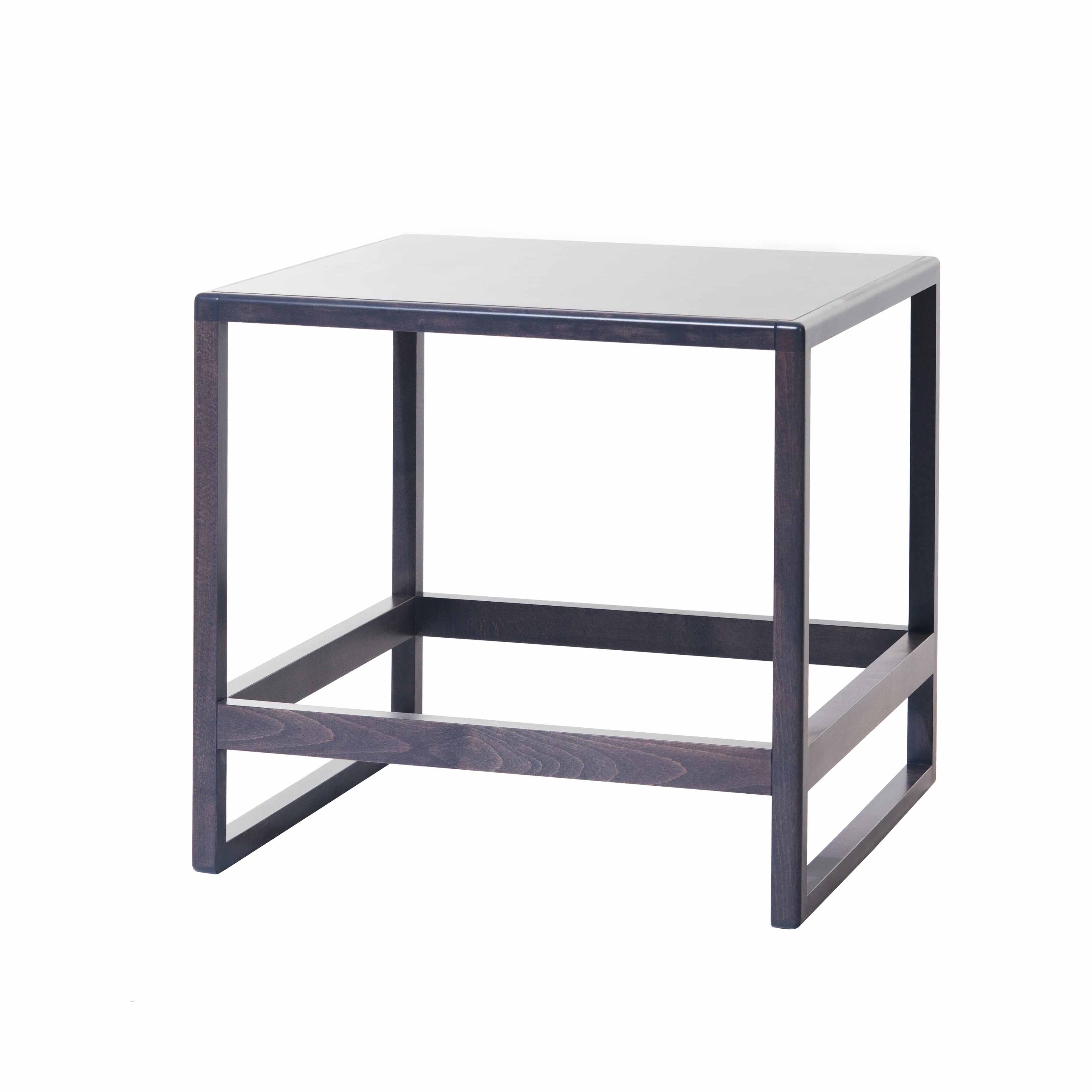 The Side Table Casablanca by TON is a minimalist black wooden square piece with simple design. It features four sturdy legs and a flat tabletop, offering a sleek, unadorned form perfect for any seating system.