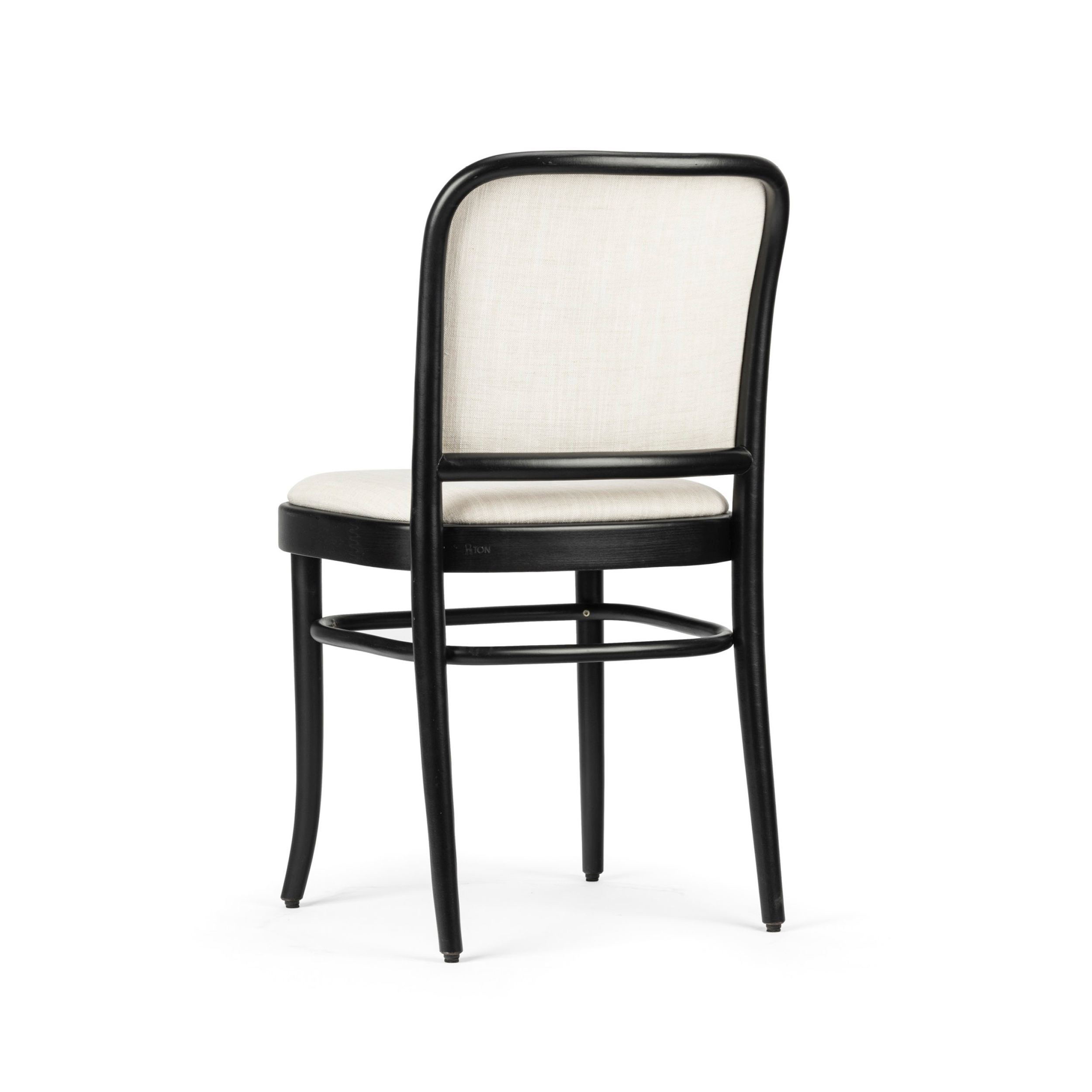 The Chair 811 - Upholstered by TON is a modern wooden dining chair featuring a curved black frame and light beige fabric. Inspired by Art Nouveau, it boasts a simple design with a comfortable padded seat and rounded back, adding sophistication to any seating area.