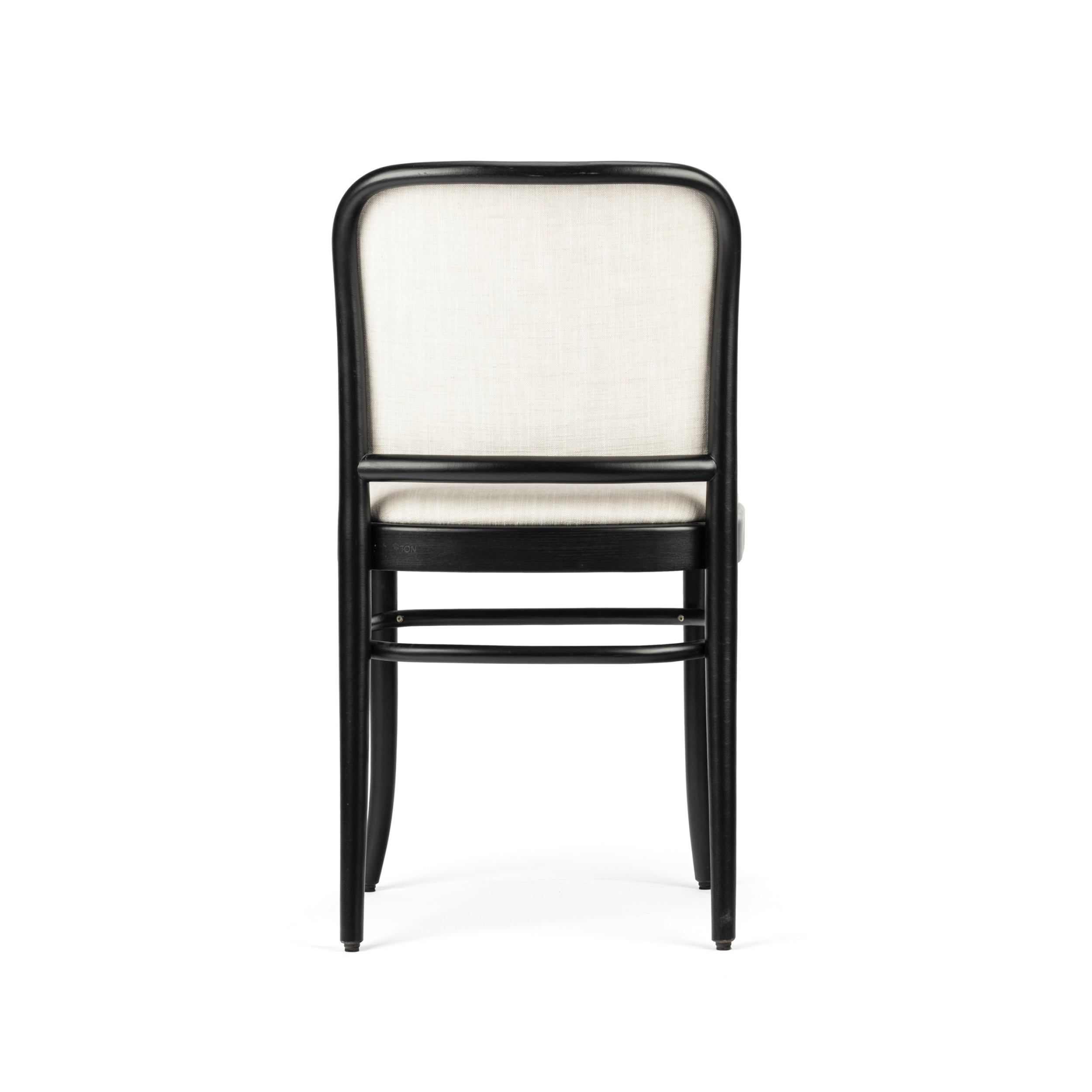 The Chair 811 - Upholstered by TON features a simple, modern design with a black wooden frame and light beige upholstered backrest and seat, viewed from behind. Inspired by Josef Hoffmanns style, it exhibits clean lines and is armrest-free against a white background.