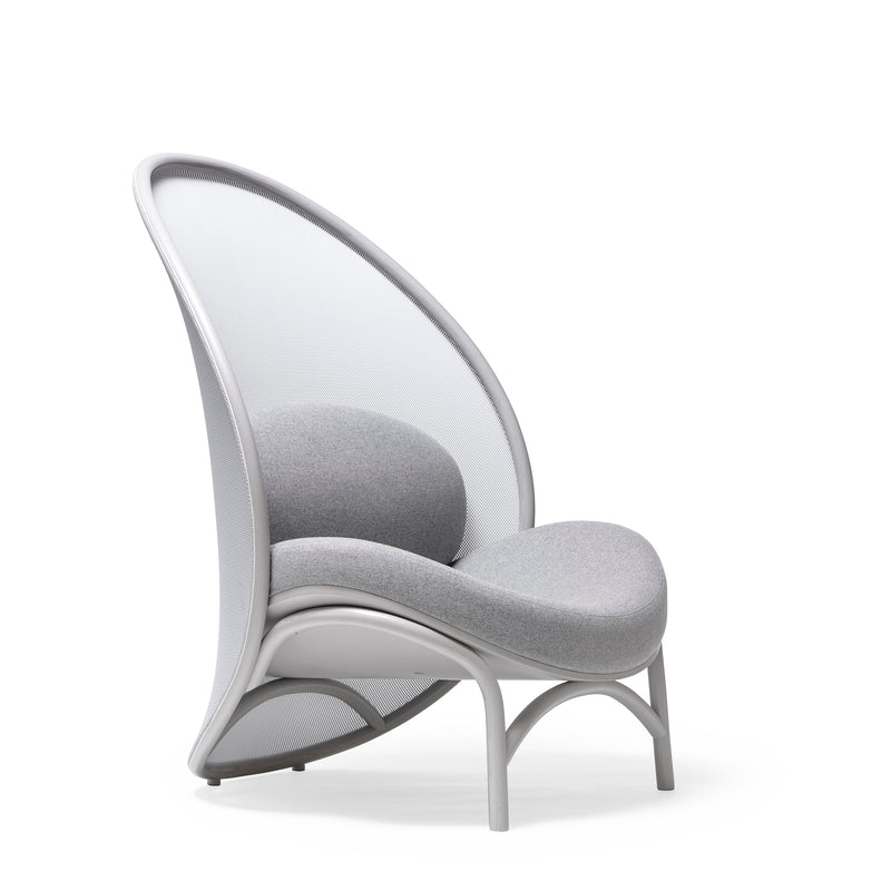 The Lounge Chair Chips by TON is a modern, stylish piece with a curvy high back, smooth rounded light gray cushion, and mesh-like back. Enhanced by sleek legs and manually-bent wood accents, it offers an elegant contemporary look.