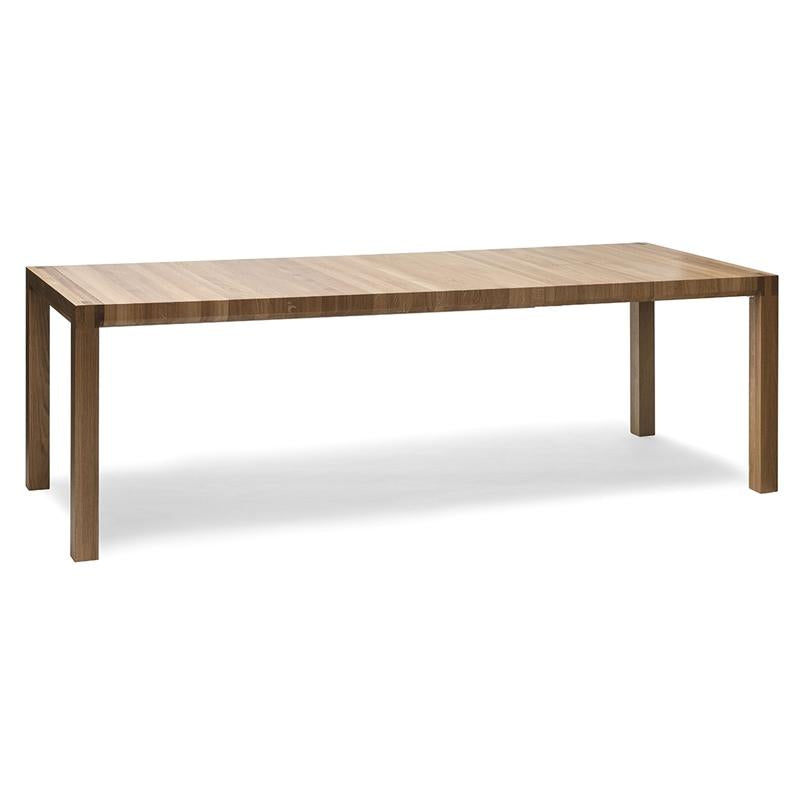 The Table Chop by TON is a rectangular solid wood table featuring a smooth light brown surface. It stands on four straight legs that match in color and material, exemplifying quality craftsmanship against a plain white backdrop.