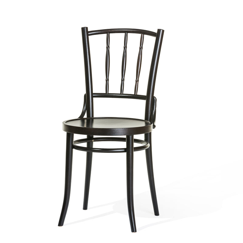 The Chair Dejavu 378 - Cane by TON is a black bent beechwood chair featuring a round seat and vertical spindle backrest. It boasts slightly curved legs for added elegance, strength, and stability, all set against a plain white background.
