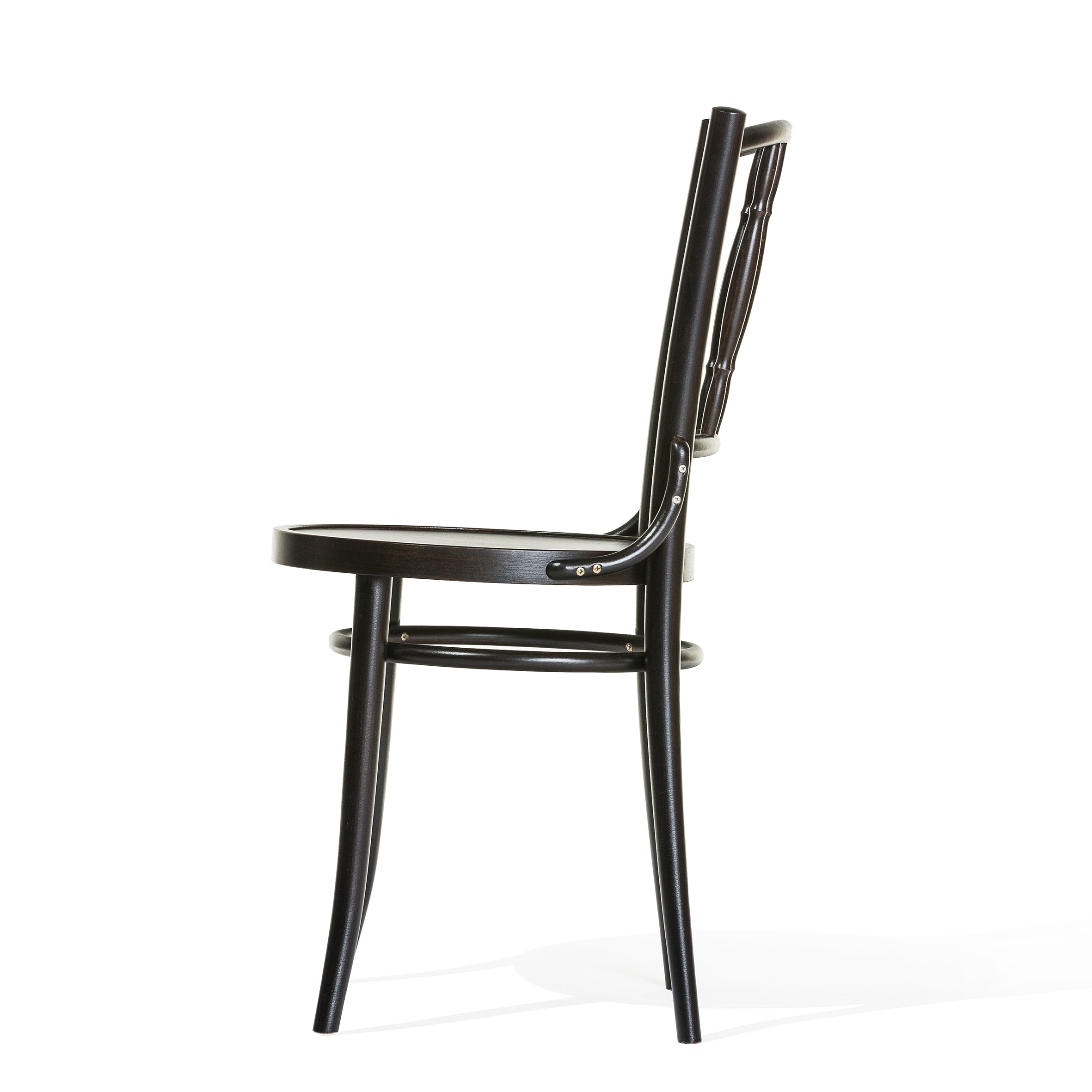 Side view of the TON Chair Dejavu 378 - Cane, crafted from bent beechwood with a curved backrest and four slender legs, highlighting its strength and stability against a plain white background.