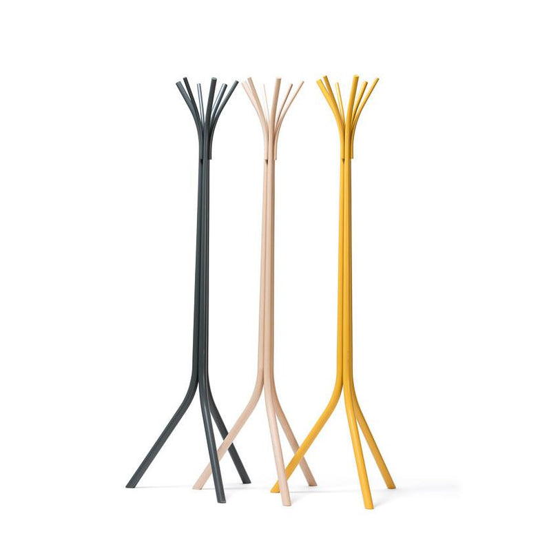 Three sleek TON Fleur Coat Stands crafted from elegant beech form a trio side by side; their tree-like design includes branching tops. They come in dark gray, light beige, and mustard yellow hues. Each stands legs splay outward for stability.