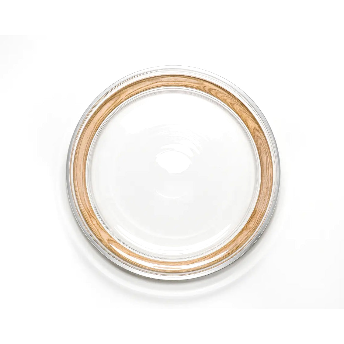 A round, transparent glass container lid with a bent wood rim is showcased on a white background. The smooth surface and elegant design reflect the refined craftsmanship of TONs Hoop Bowl.