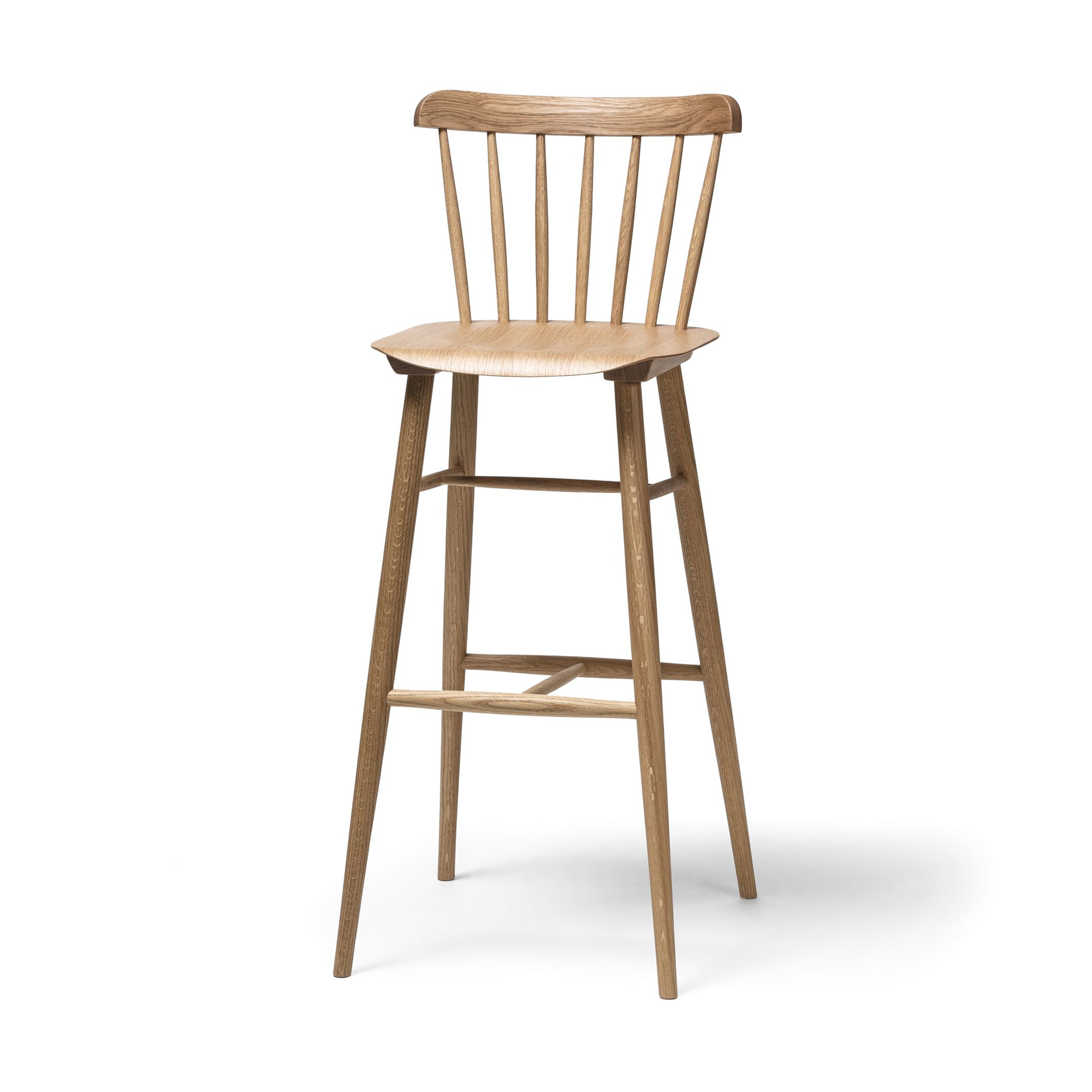The Barstool Ironica by TON showcases a curved backrest with five vertical slats. Crafted from beech and oak, it features a natural finish. Its four tapered legs are connected by hand-finished dowels and crossbars, offering sturdy support, elegantly highlighted on a white background.