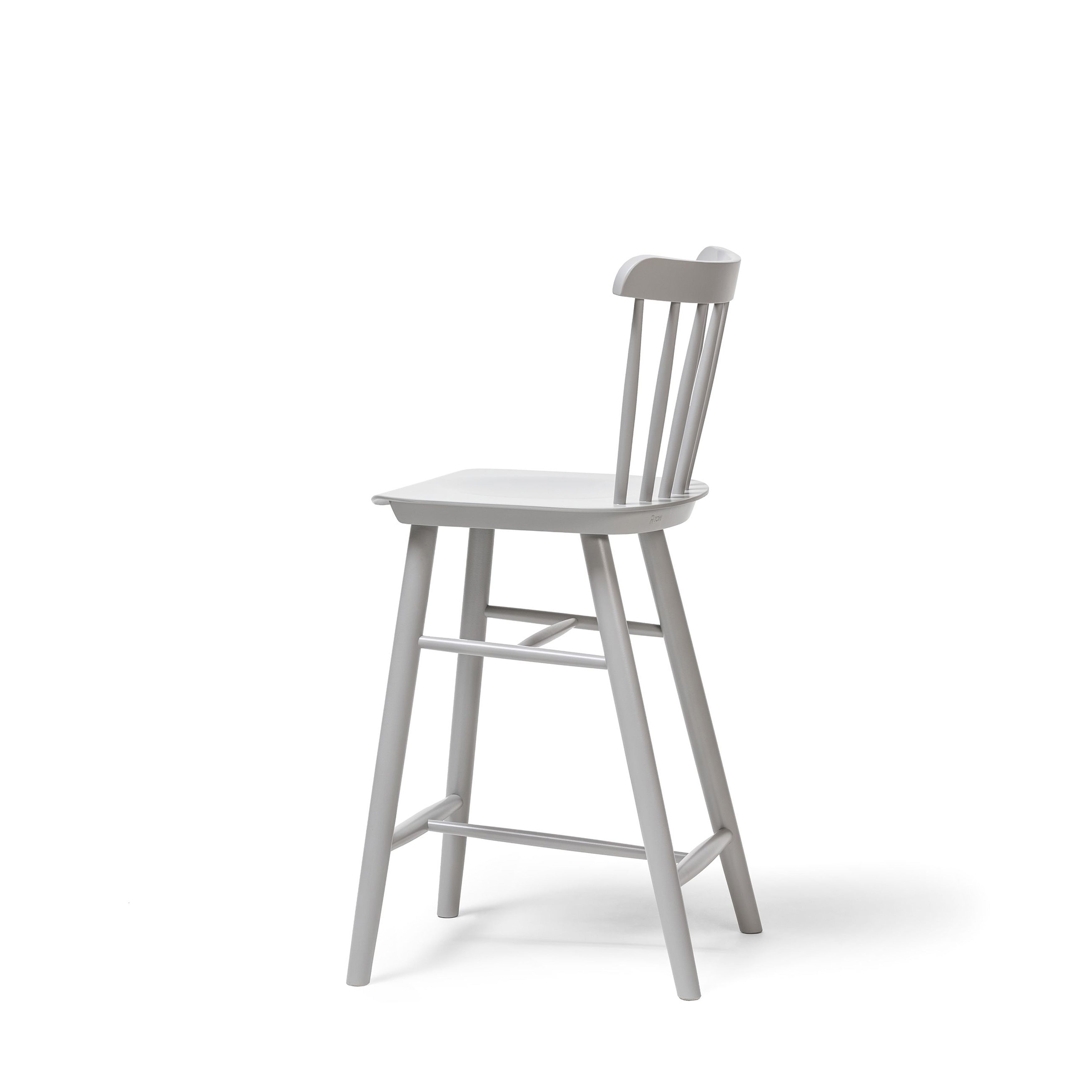 The Barstool Ironica by TON showcases a side view of a light gray wooden design crafted from beech and oak. It features a slatted backrest and four legs with horizontal supports, accented by hand-finished dowels, all on a plain white background.