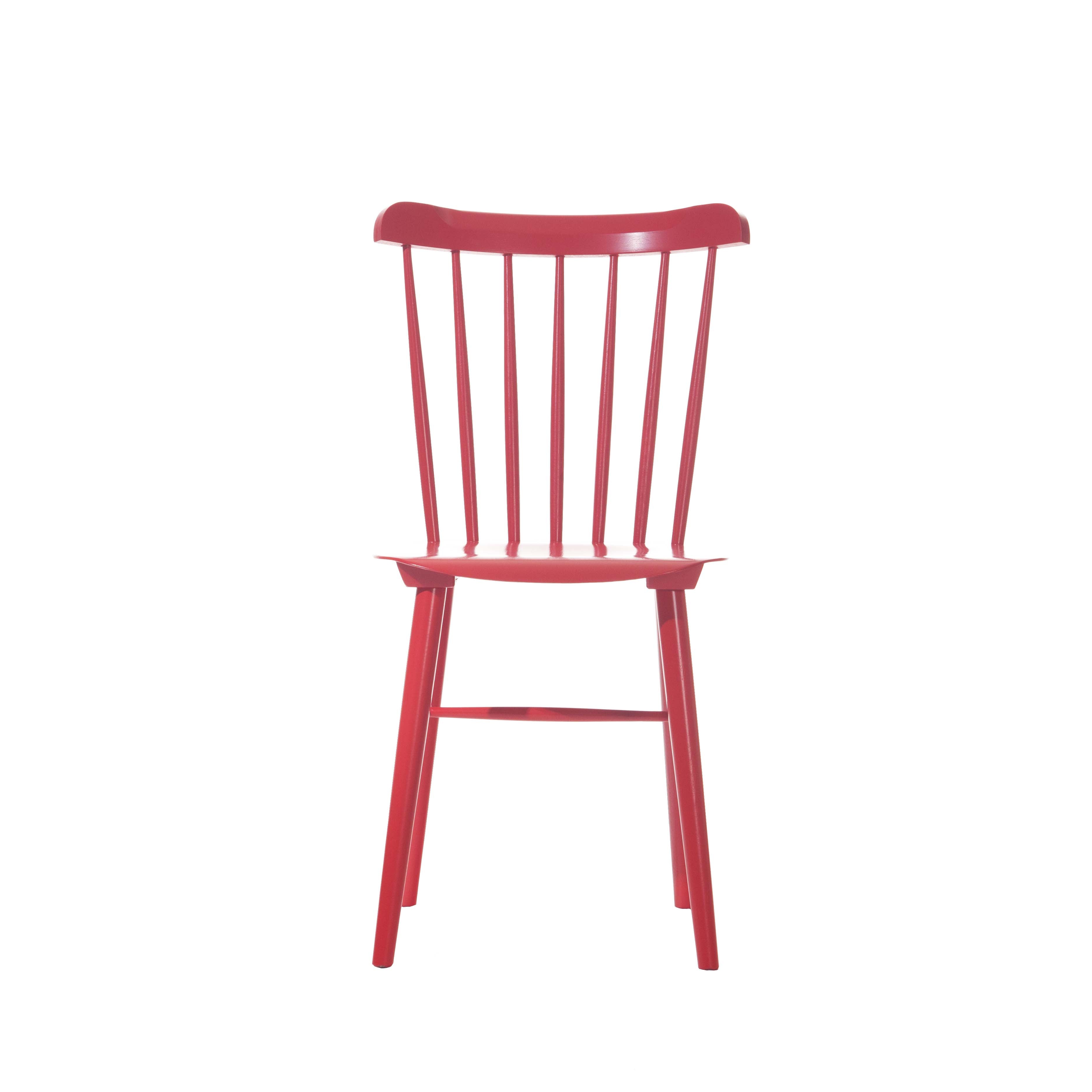 The Chair Ironica by TON is crafted from beech with a red frame, a high back with vertical slats, four legs, and a retro design. This armless dining chair offers simple elegance against a plain white background.