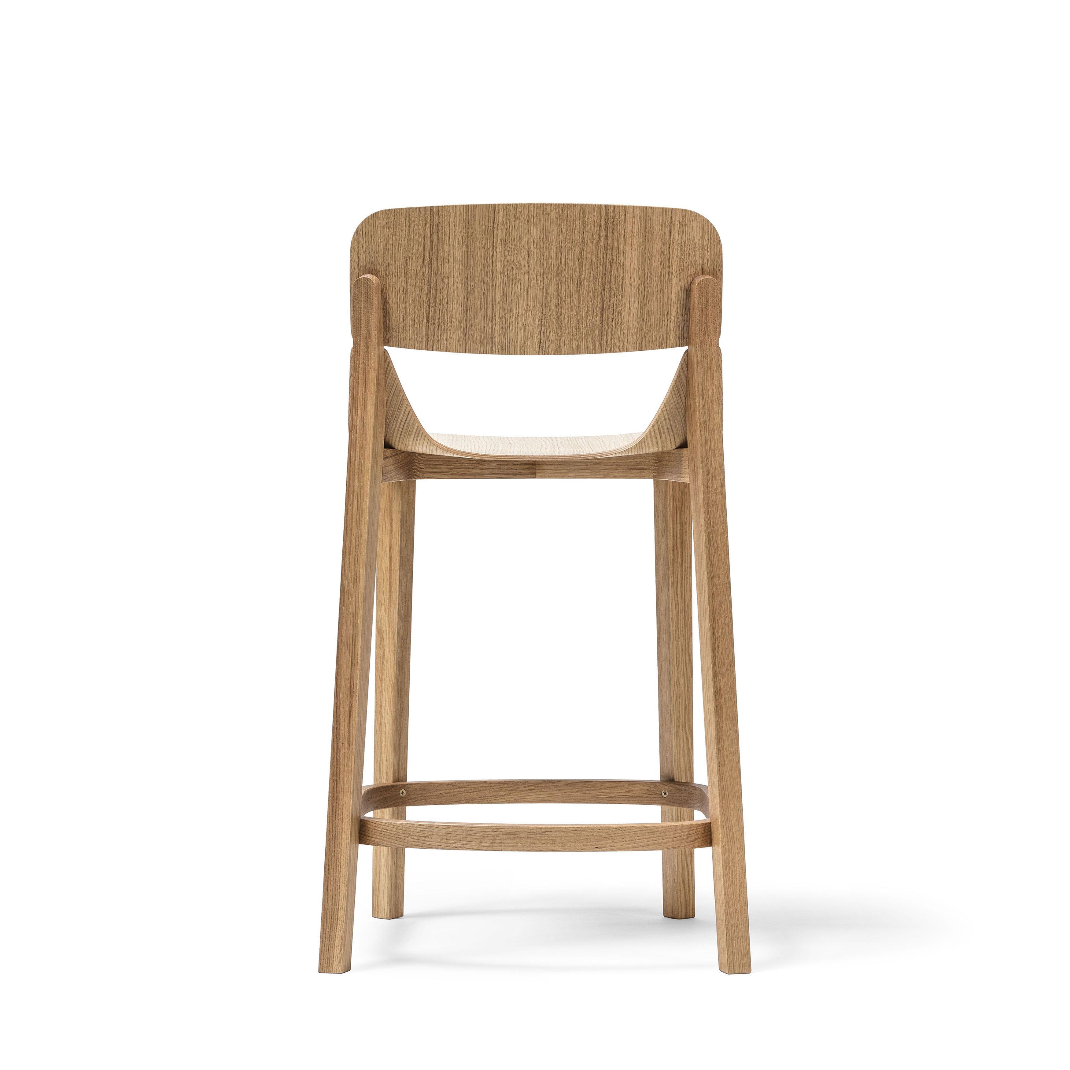 The Barstool Leaf with Backrest by TON boasts ergonomic design with a curved backrest and sturdy legs. Its minimalist style features a footrest connecting the legs, set against a white backdrop—ideal for enhancing both style and comfort in any space.