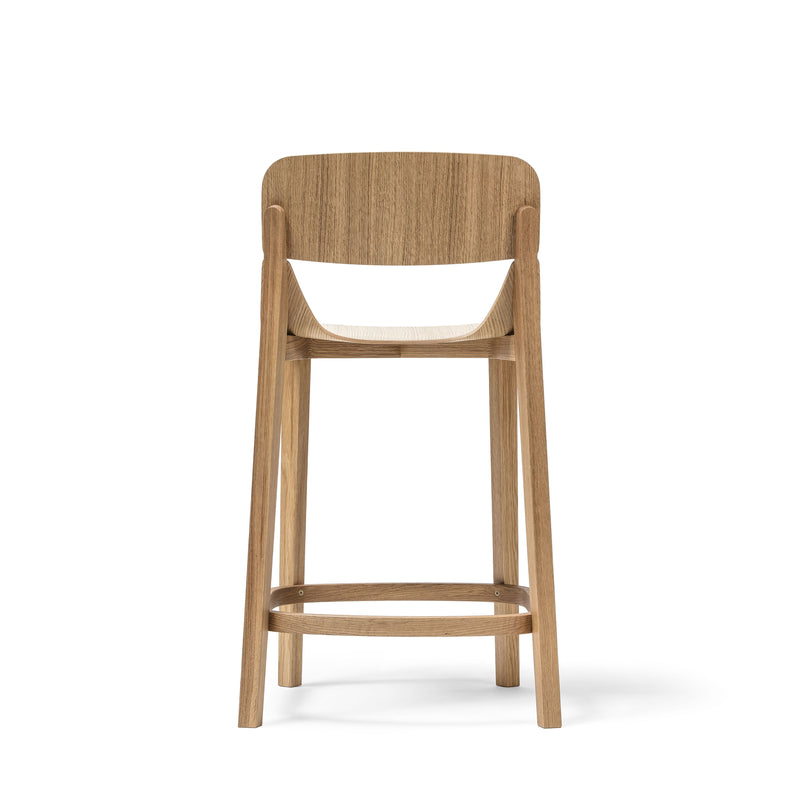 The Barstool Leaf with Backrest by TON boasts ergonomic design with a curved backrest and sturdy legs. Its minimalist style features a footrest connecting the legs, set against a white backdrop—ideal for enhancing both style and comfort in any space.