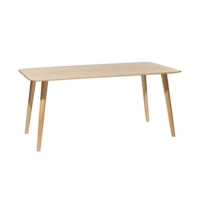 The Table Malmö 706 by TON, characterized by its wood tabletop, rectangular shape, and four angled legs, is set against a plain white backdrop, highlighting its simple minimalist style rooted in Scandinavian design.