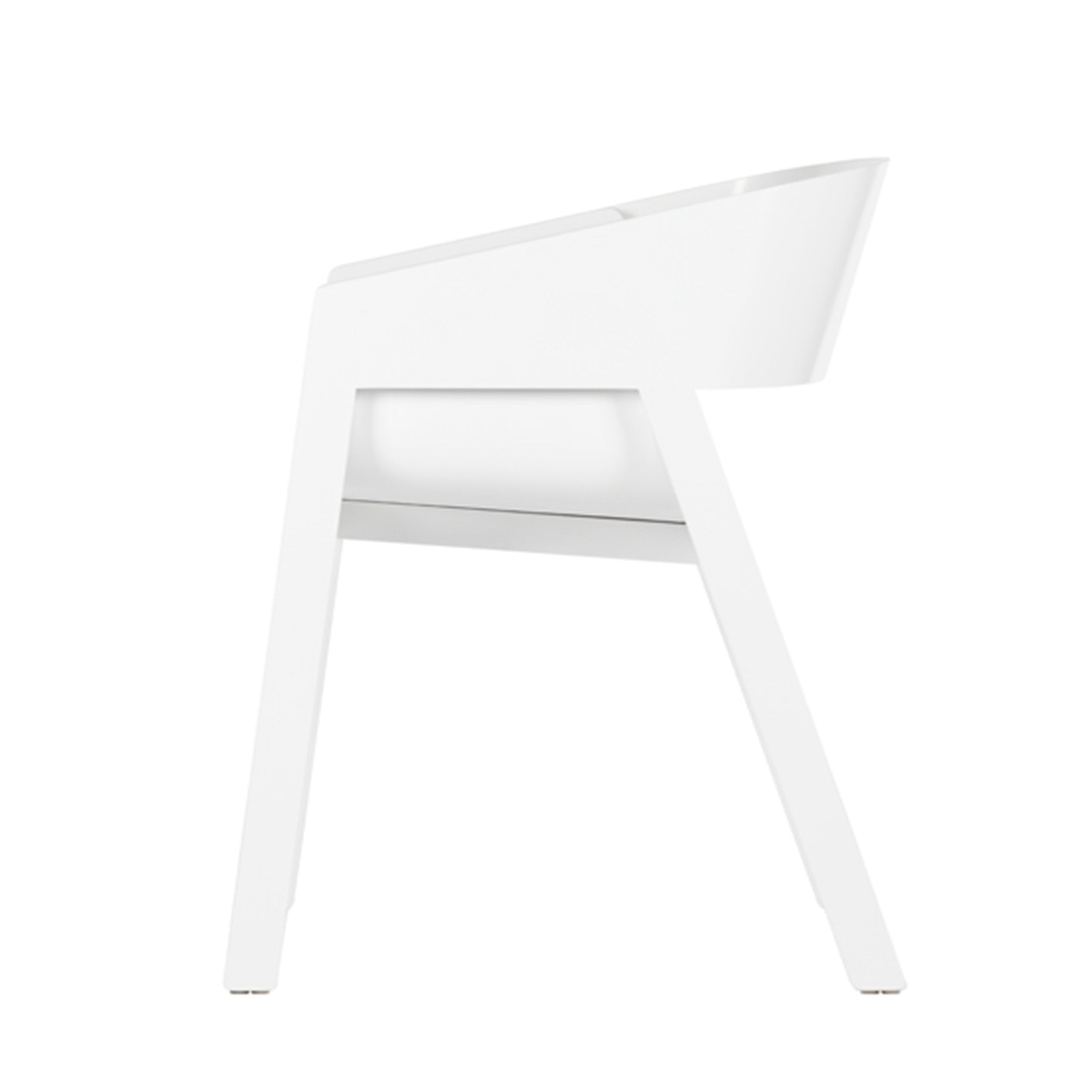 Side view of a modern, minimalist Armchair Merano by TON with a curved backrest and angled legs against a white background. The solid wood frame enhances its sleek aesthetic, emphasizing simplicity similar to the TONDesigner Armchair.