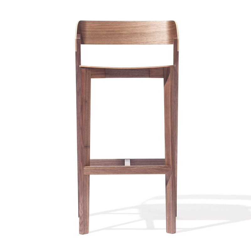 The Barstool Merano - Sale by TON shows off a minimalist design with clean lines, a rectangular seat, and front footrest. Crafted from solid wood with a natural finish, it highlights the wood grain beautifully.