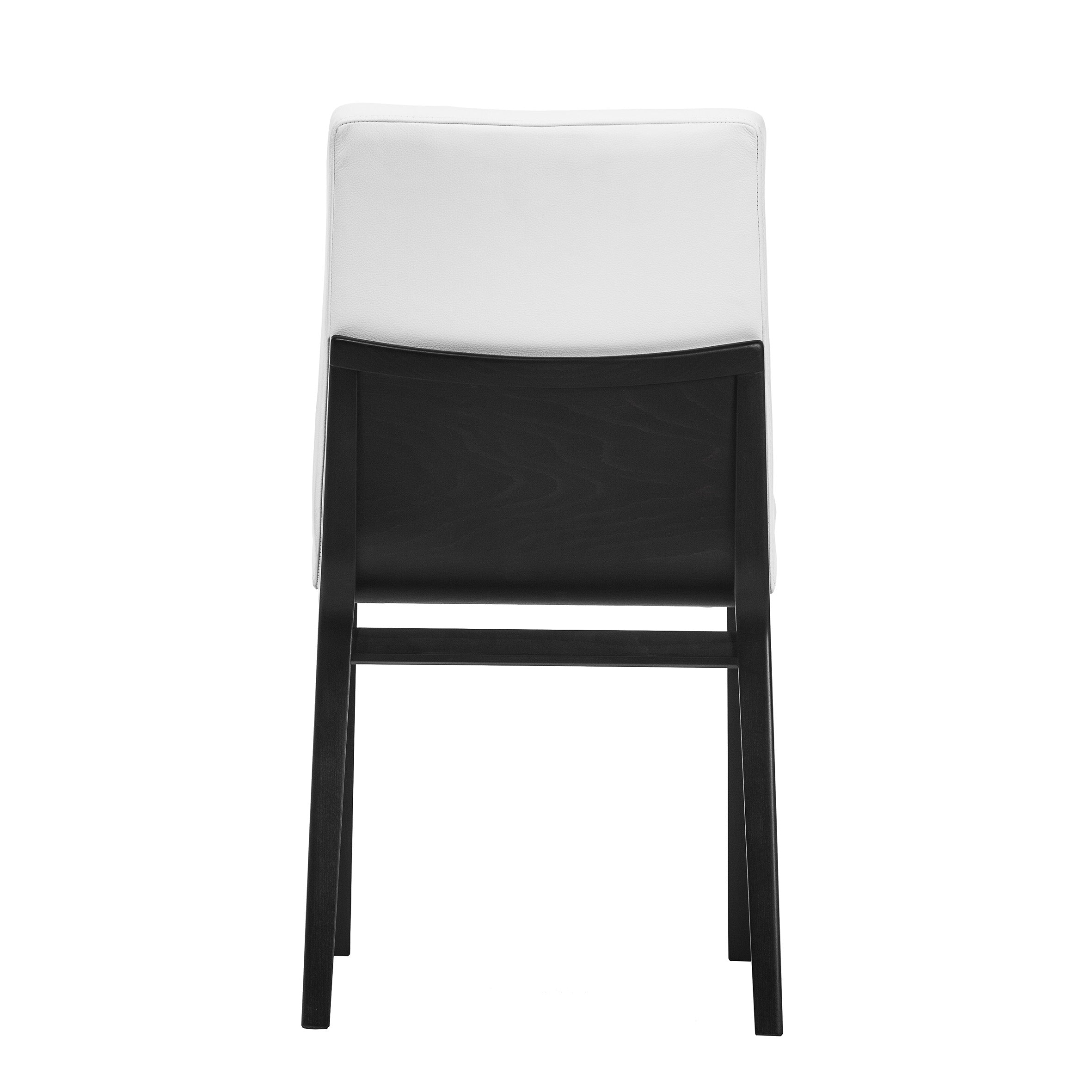 The Armchair Moritz by TON is a modern white chair with black wooden framing, ergonomic design, and stands on four hand-smoothed oak legs. The contrast between the white upholstery and black frame enhances its sleek, contemporary appeal from a rear view.