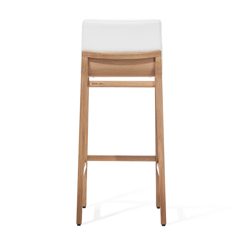 The Barstool Moritz by TONDesigner is a premium ergonomic furniture piece with a minimalist design. It features four legs, a horizontal support beam, and boasts a natural wood finish with a modern touch. The stool comes equipped with a white seat cushion and is crafted by TON.